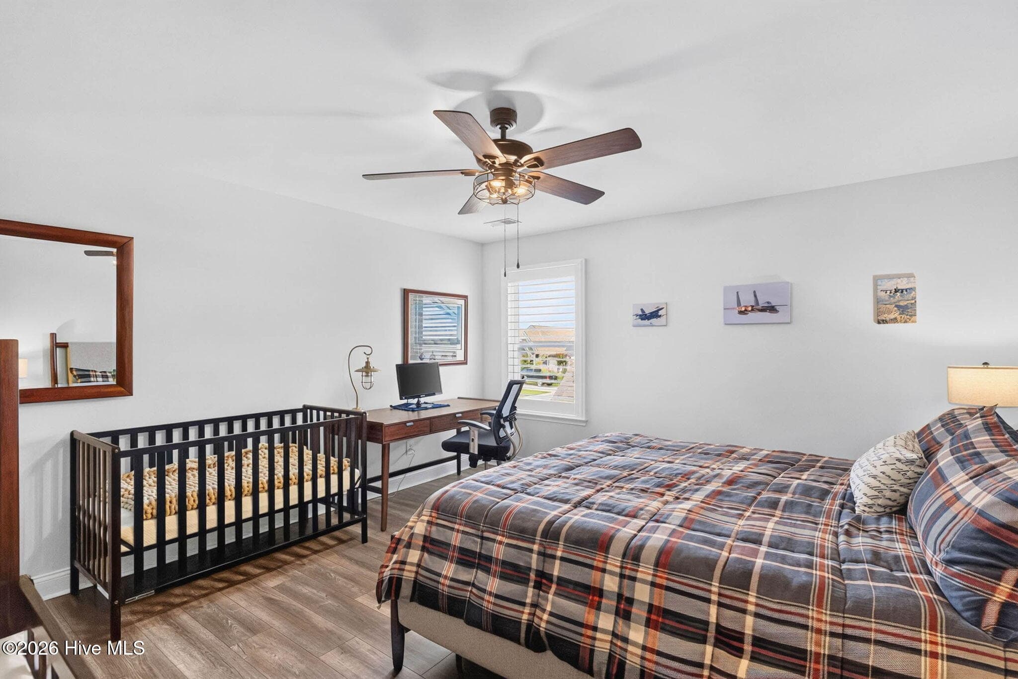 This spacious secondary bedroom offers room for multiple beds, making it ideal for guests or a shared bedroom. - 139 Eagle Claw Drive, Calabash, NC 28467