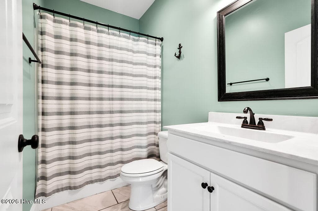 Single Family Residence at 155 NE 18th Street, Oak Island, NC 28465, photo 2 of 2