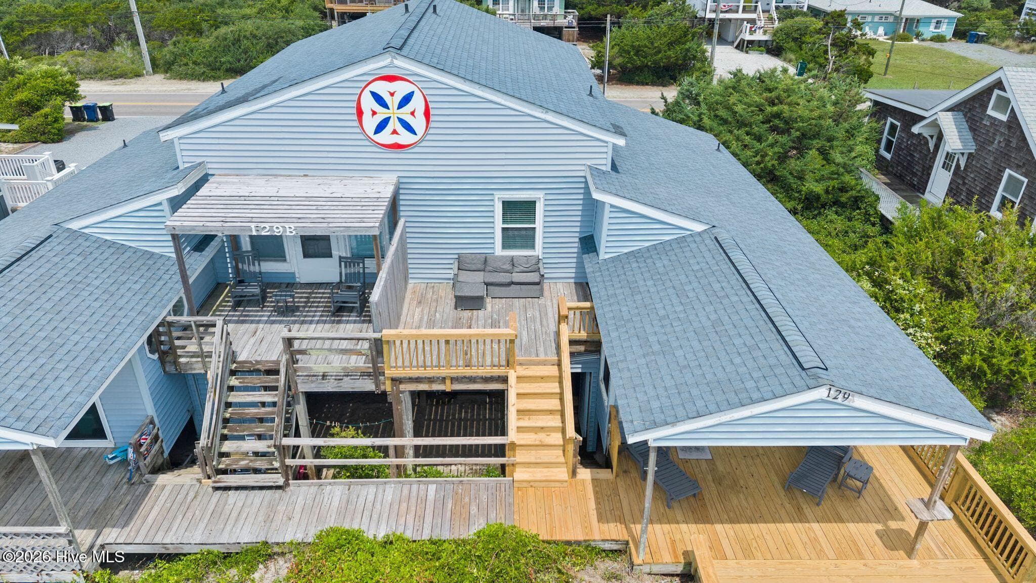 Three levels and a whole lot of outdoor living. - 129 S Anderson Boulevard A, Topsail Beach, NC 28445