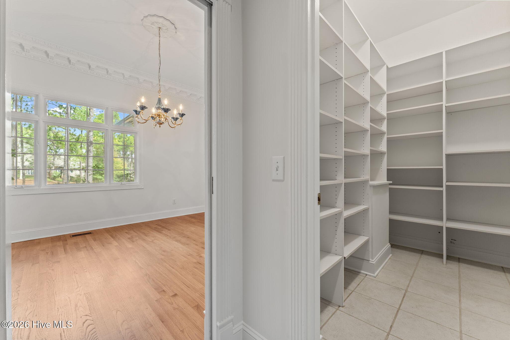 Kitchen pantry with door to the dining room. - 22 Lochmere Drive, Pinehurst, NC 28374