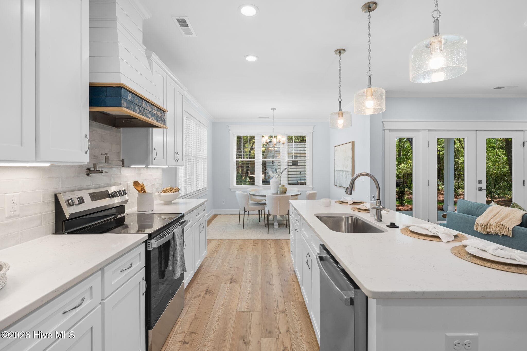 Photos of a staged model of the exact same plan - 312 NE 58th Street, Oak Island, NC 28465