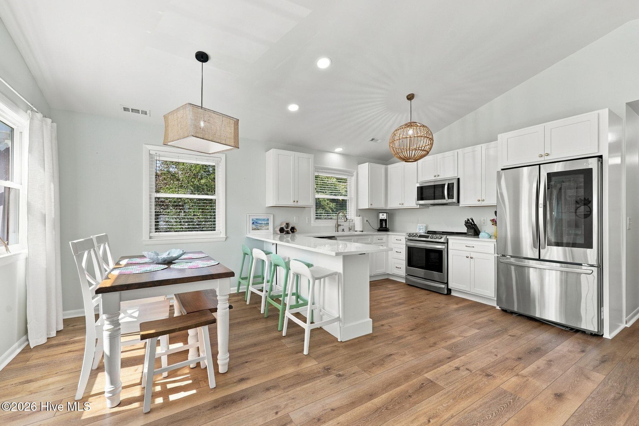 Nicely updated kitchen with bar and dining area - 118 Periwinkle Drive, Emerald Isle, NC 28594
