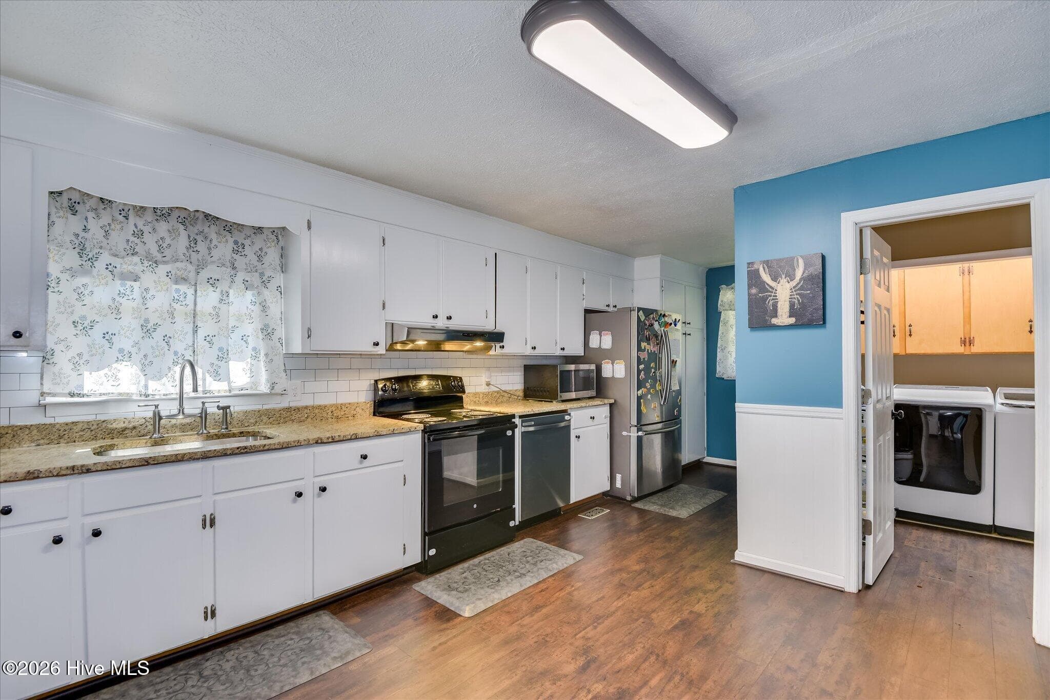 Oversized kitchen with newly installed granite counter tops and plenty of cabinet space along with laundry room that can double as a walk-in pantry! - 1445 Pine Log Road, Aiken, SC 29803