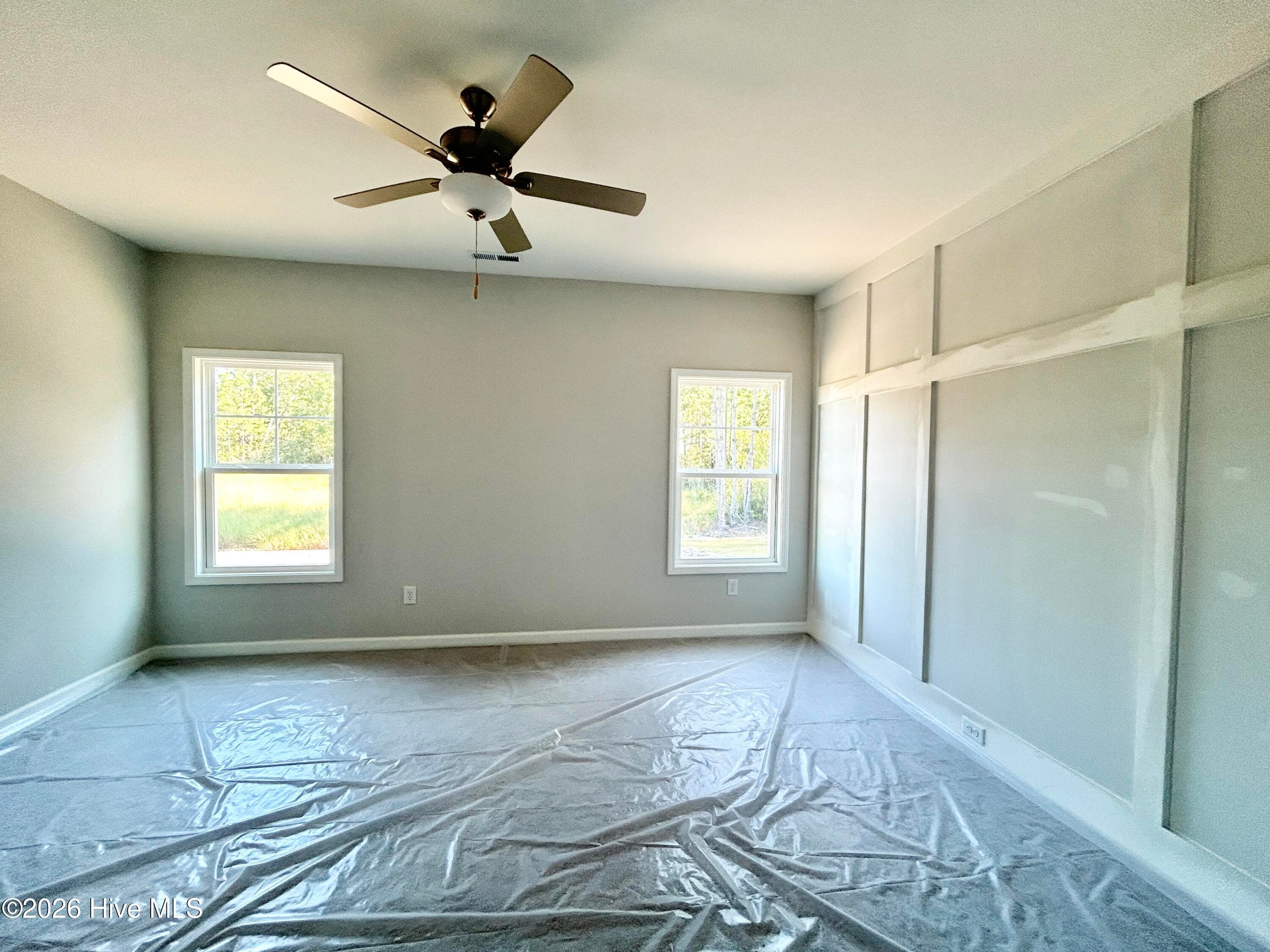Primary Suite features a Private Bathroom with Tile Shower and Large Walk-in Closet - 4188 Workman Loop 89, Leland, NC 28451