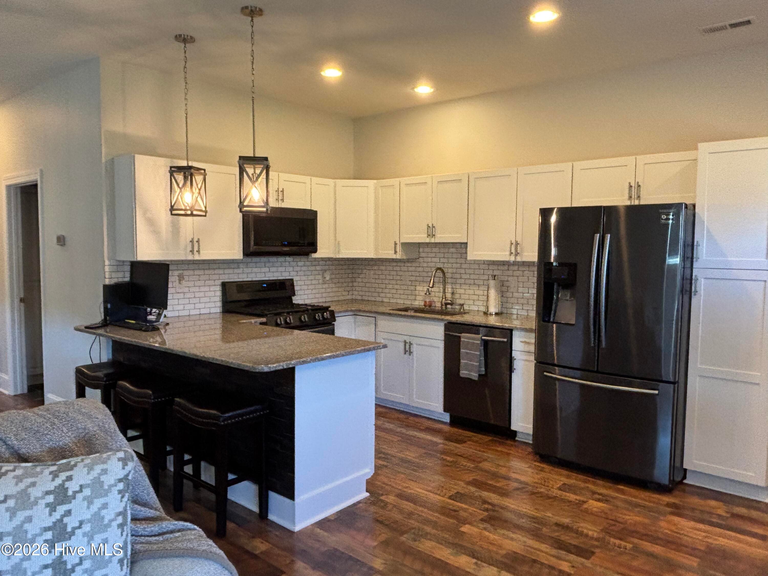 Open kitchen with gorgeous Samsung dark stainless appliances - 593 La Wane Lane, Trenton, NC 28585
