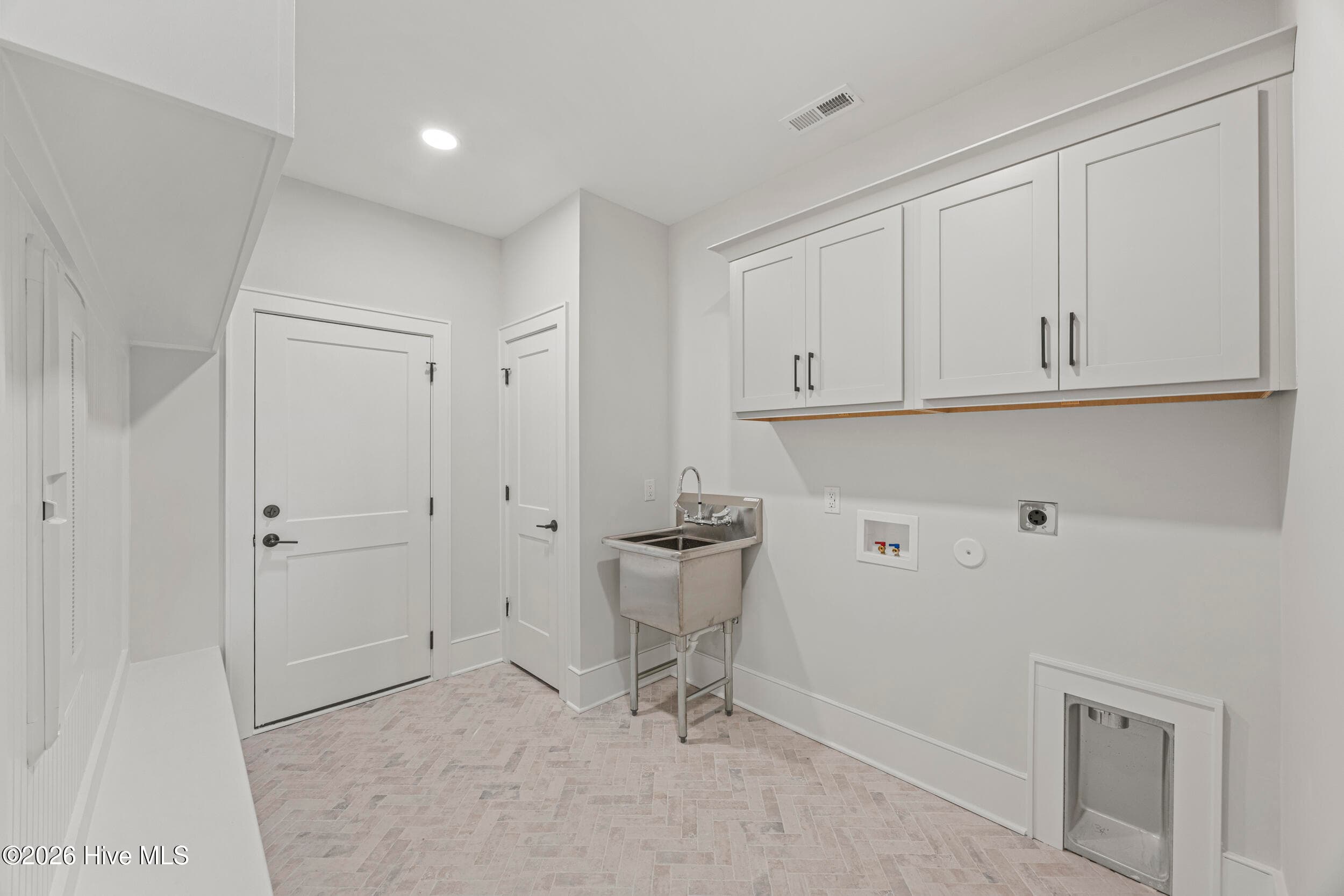 Laundry room with cabinets, dropzone and sink! - 117 Grand Harvest Court, Wilmington, NC 28411