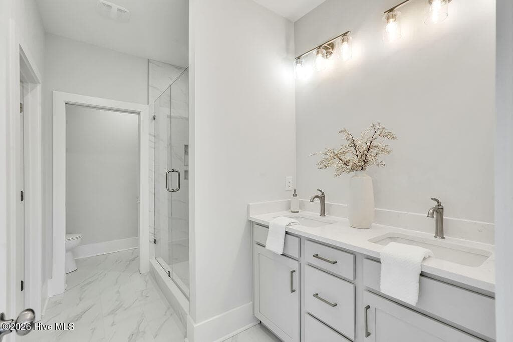Primary Bathroom with Quartz Countertops and Dual Vanity - 5202 Moonshell Loop, Wilmington, NC 28412