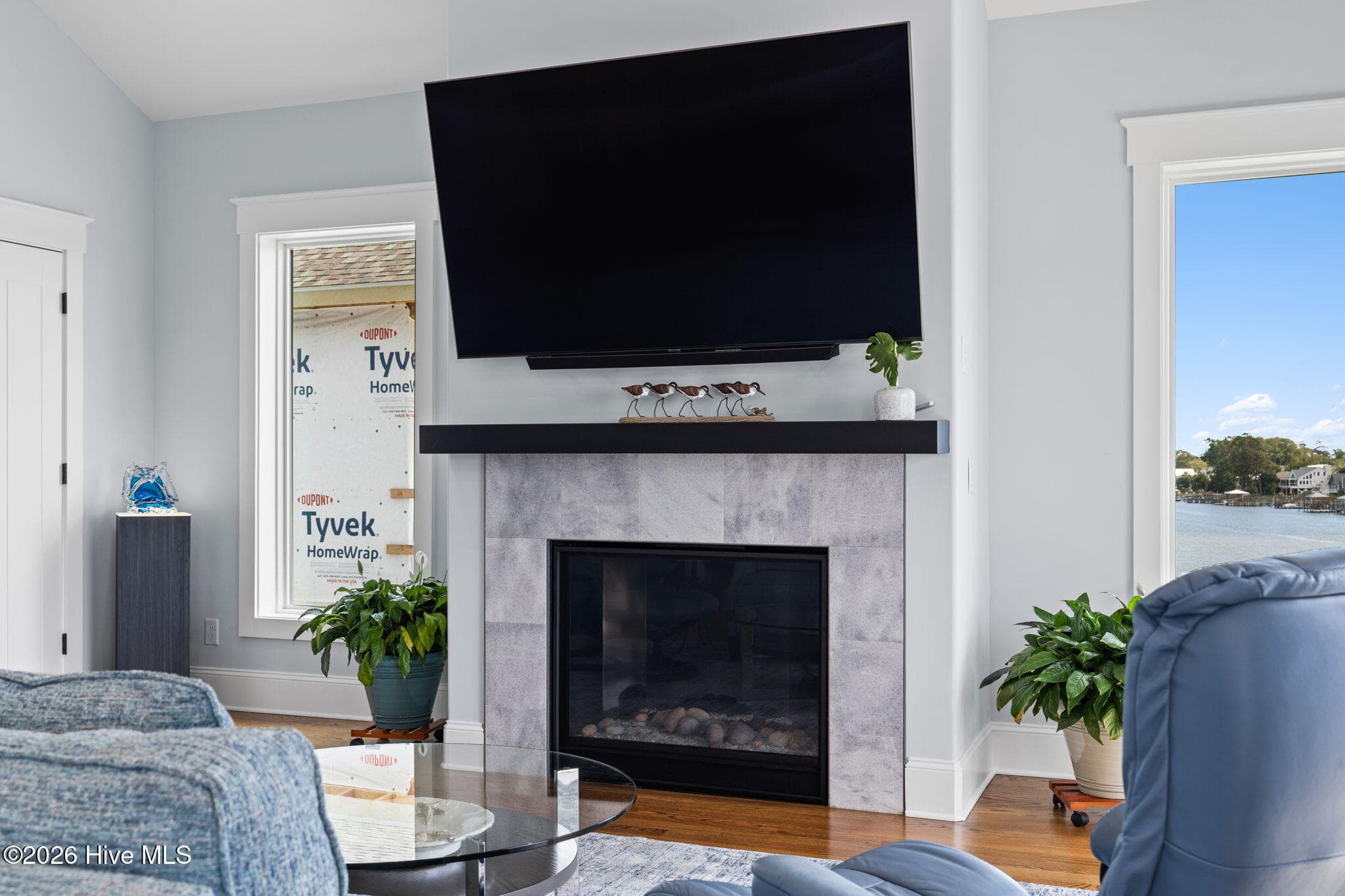 Tile surround propane fireplace with metal mantel and space for large TV - 2775 Long Bay Drive SE, Southport, NC 28461