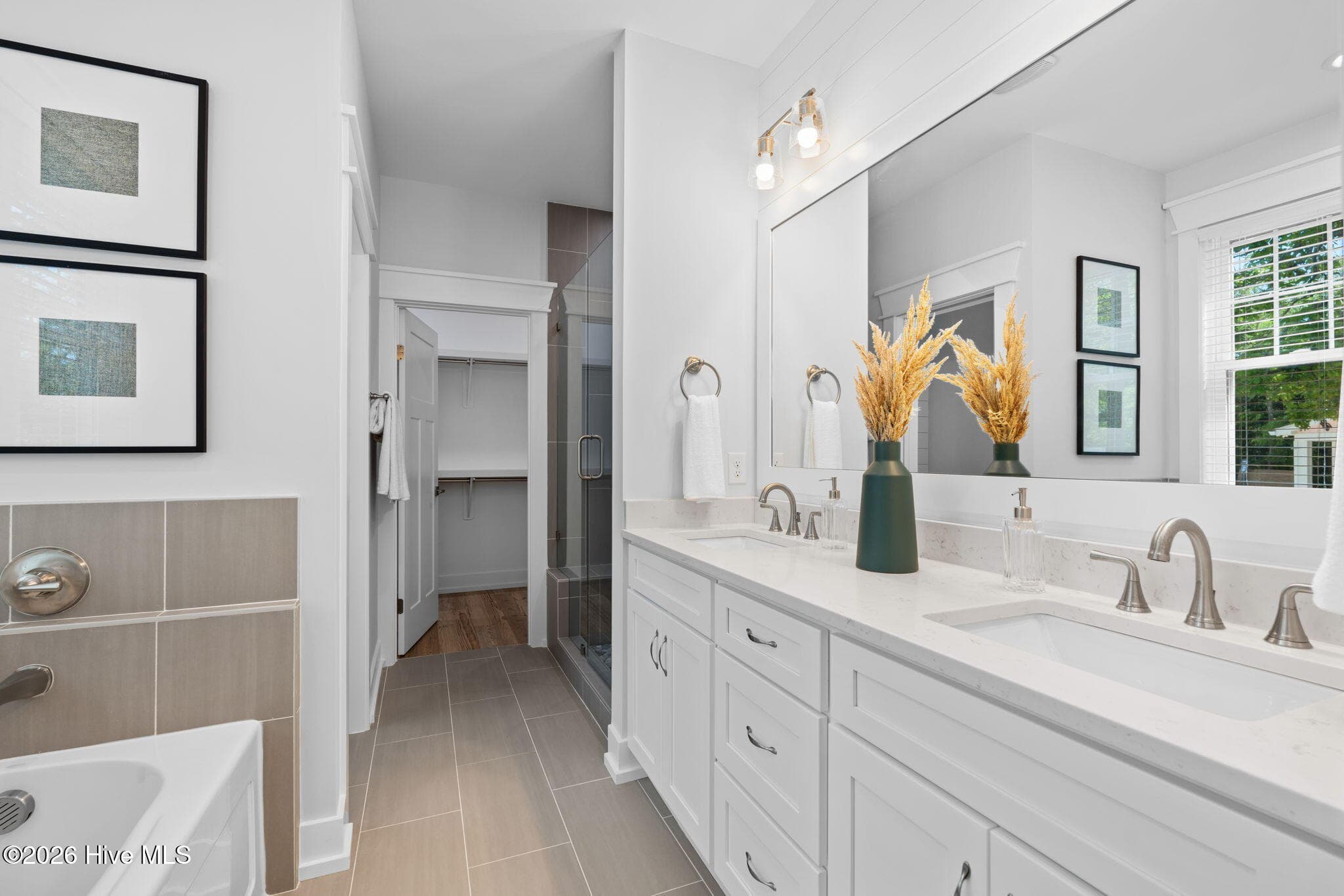 Photos of a staged model of the exact same plan - 312 NE 58th Street, Oak Island, NC 28465