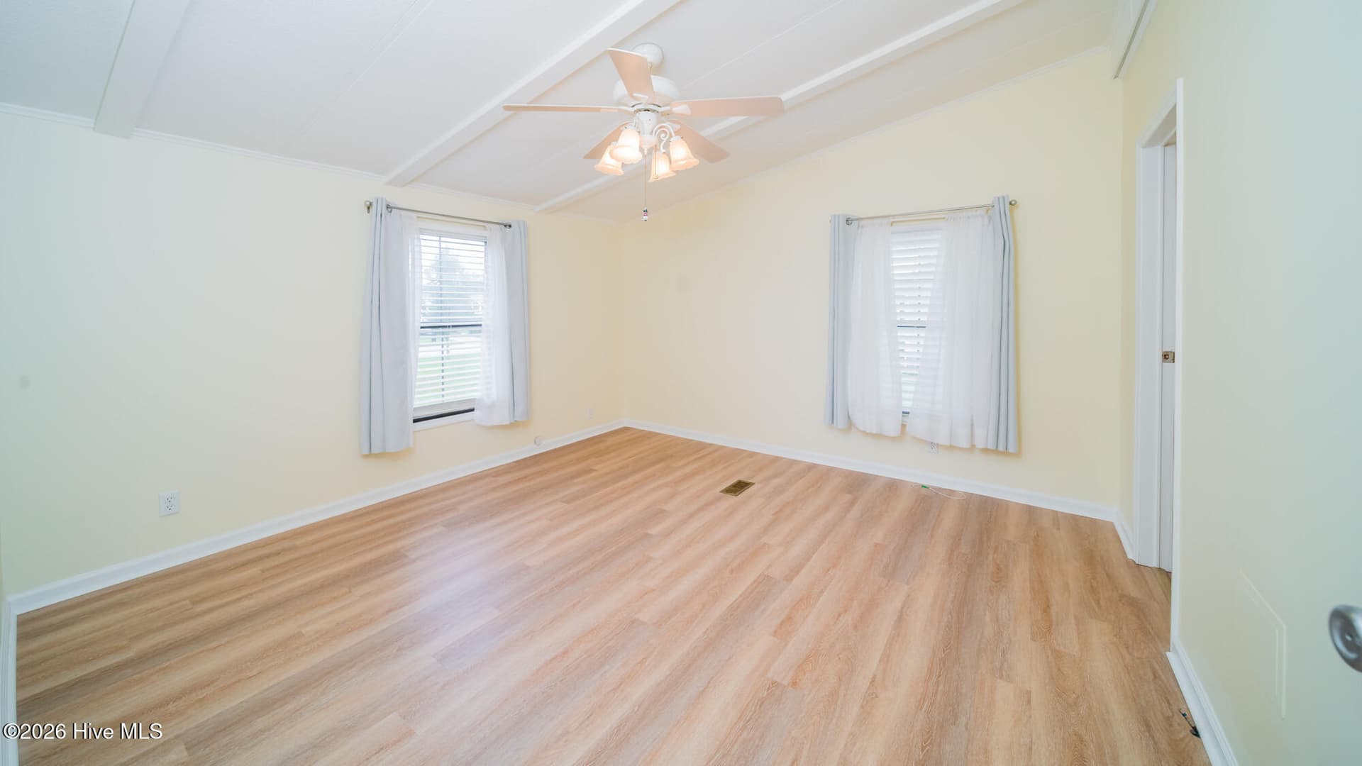 Spacious primary bedroom with ceiling fan - 1076 Clubview Lane SW, Calabash, NC 28467