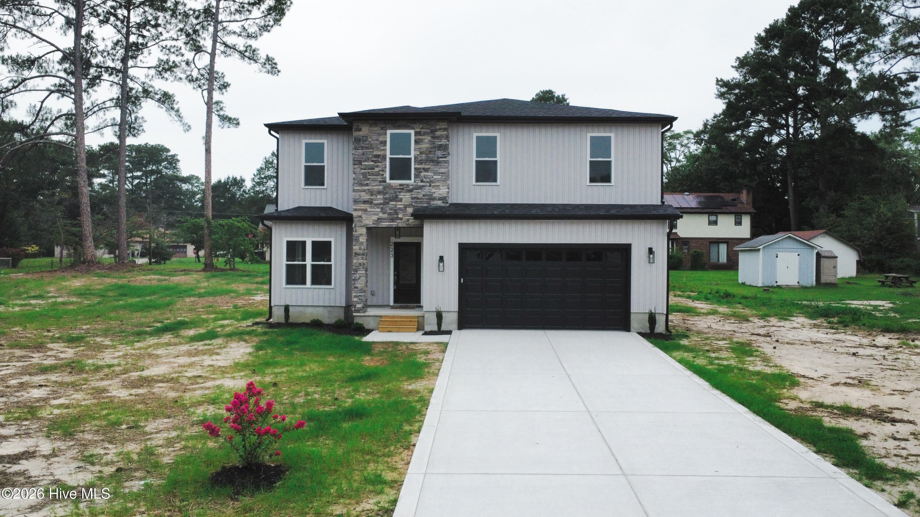 Stone and black garage door - 223 Glenwood Trail, Goldsboro, NC 27534