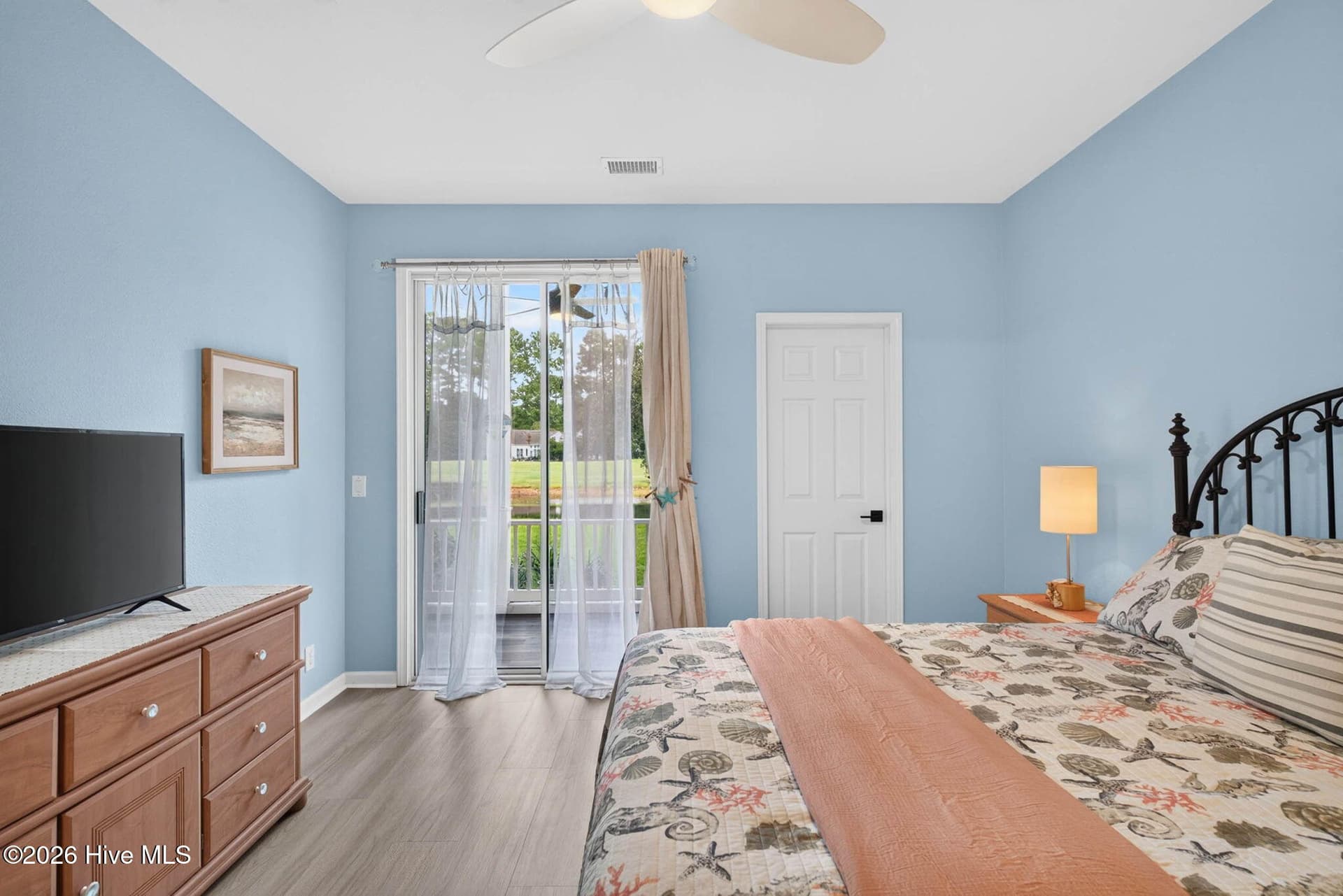 Primary Bedroom overlooks pond and golf cousre - 874 Great Egret Circle SW 7a, Sunset Beach, NC 28468