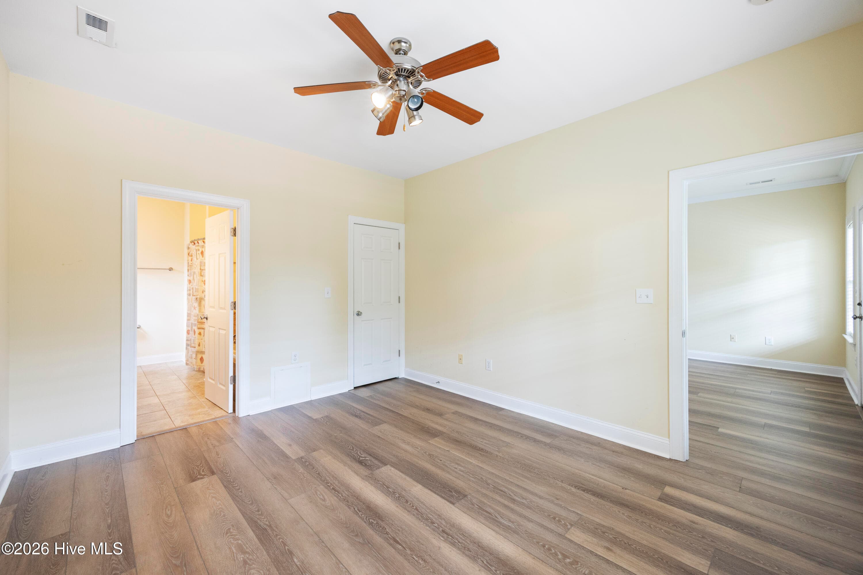PRIMARY BEDROOM with En Suite Bathroom and Walk-In Closet - 225 NE 39th Street, Oak Island, NC 28465