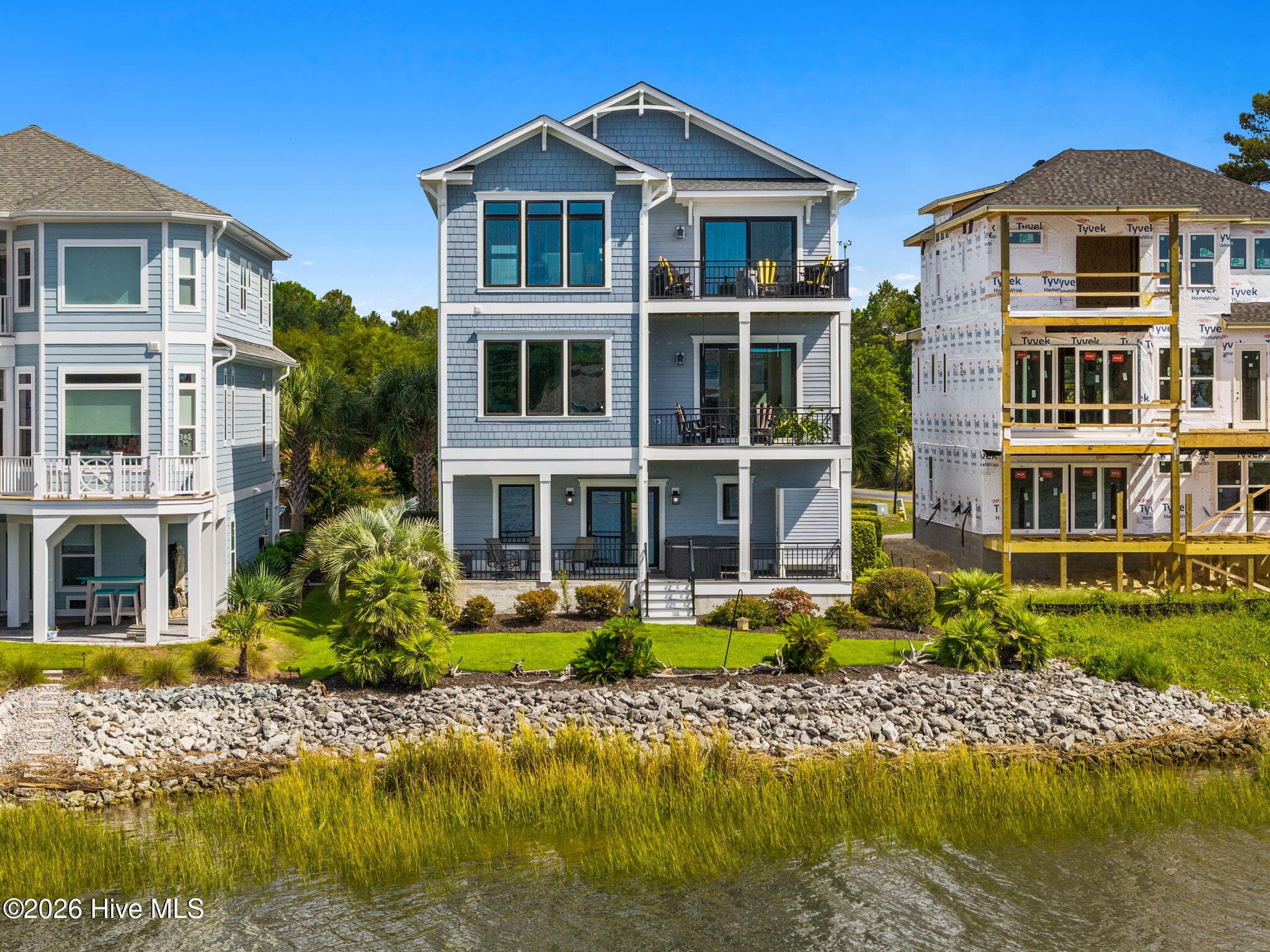 Directly on the ICW with a riprap seawall and professional landscaping - 2775 Long Bay Drive SE, Southport, NC 28461