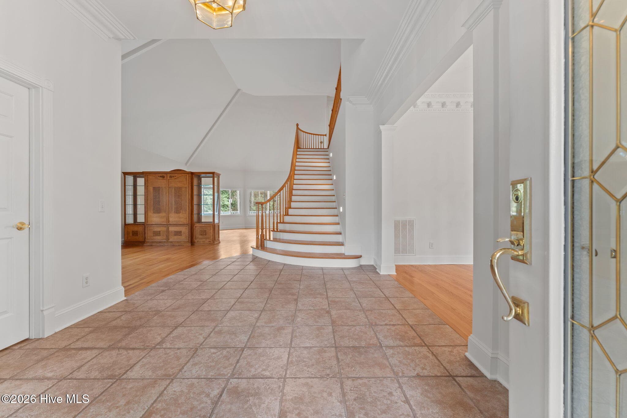 Foyer entrance with a beautiful look at the grand staircase. - 22 Lochmere Drive, Pinehurst, NC 28374