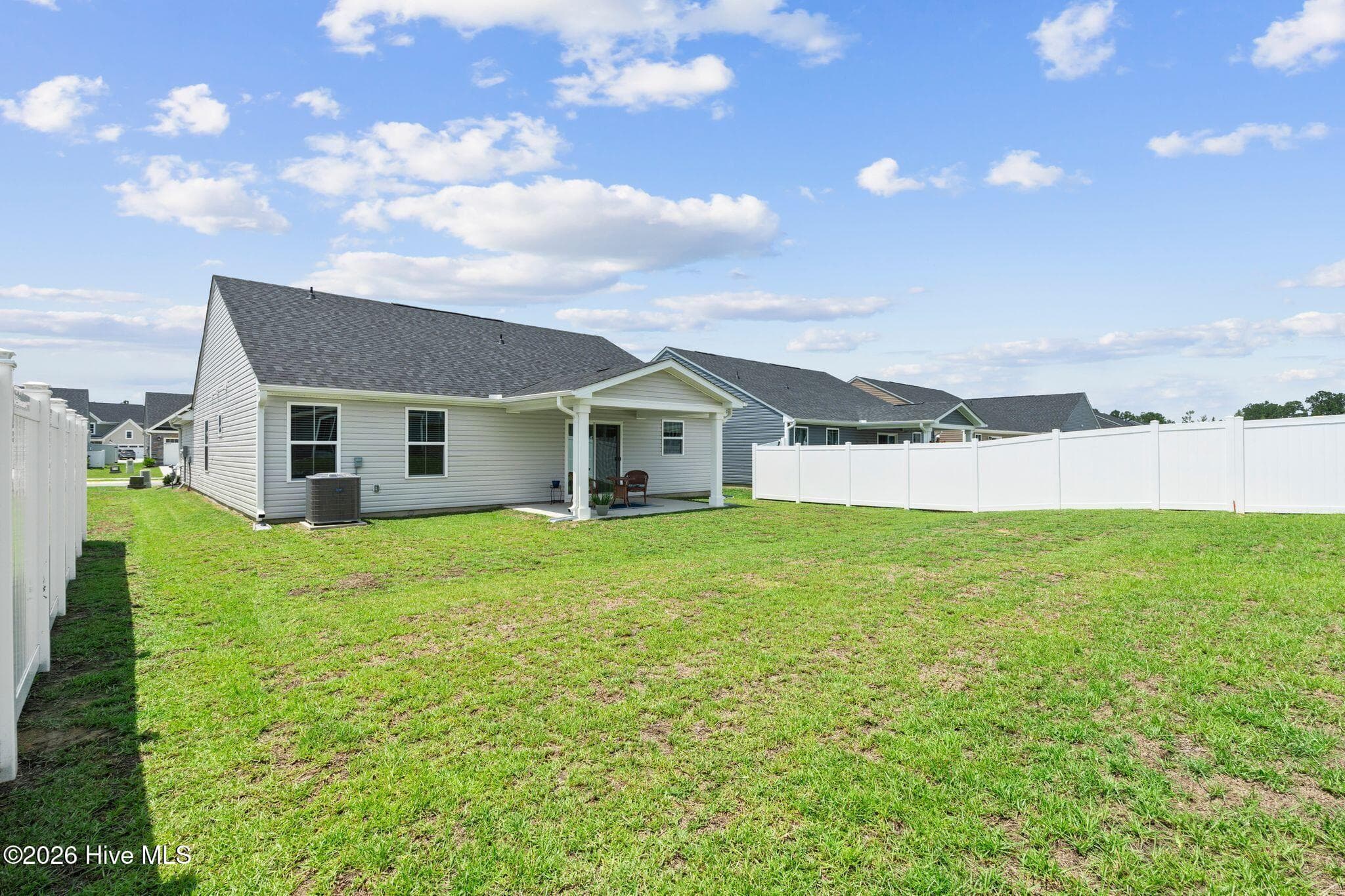 BACK YARD AND COVERED BACK PORCH - 967 Rindlewood Trail NE, Bolivia, NC 28422
