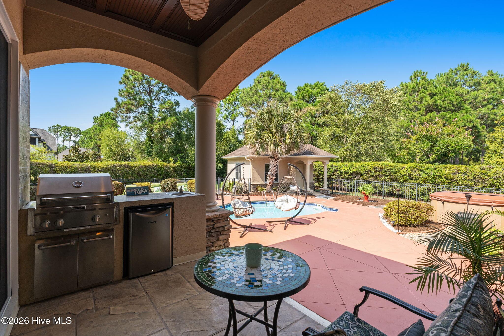 Outside kitchen has grill, sink and frig - 3858 Ridge Crest Drive, Southport, NC 28461