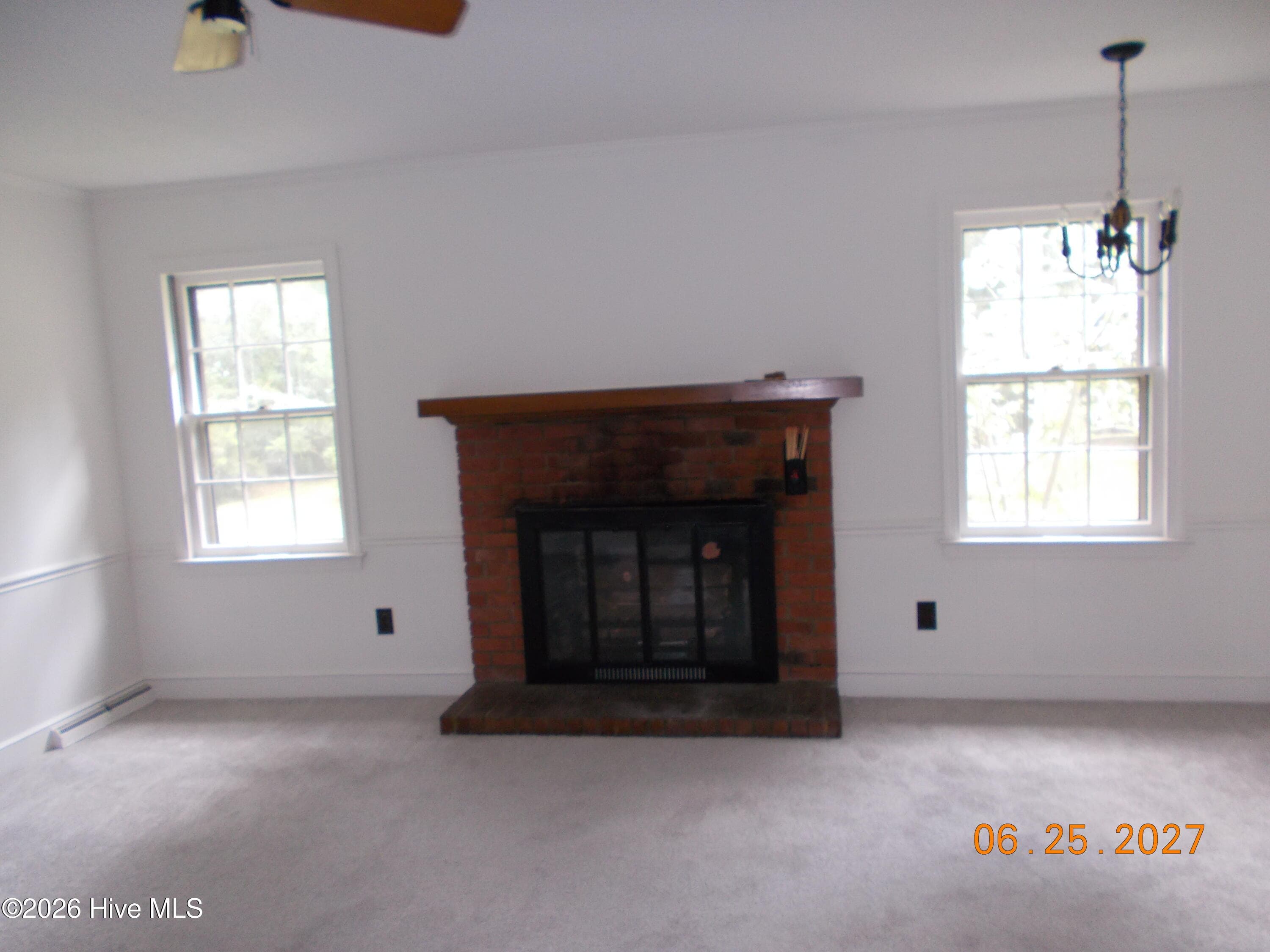 Family room with fireplace and logs - 2209 Stanton Road, Kinston, NC 28504
