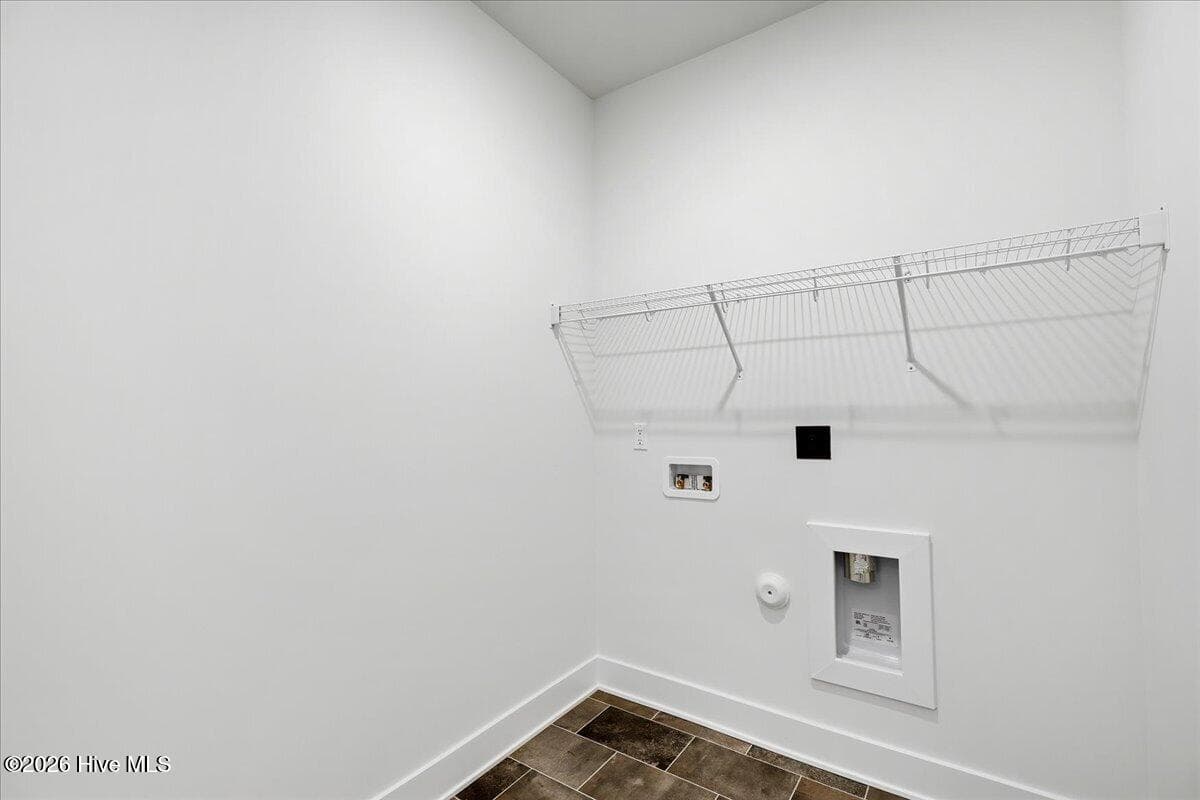 Laundry Room on main level on other side of kitchen. - 108 Brighton Street, La Grange, NC 28551