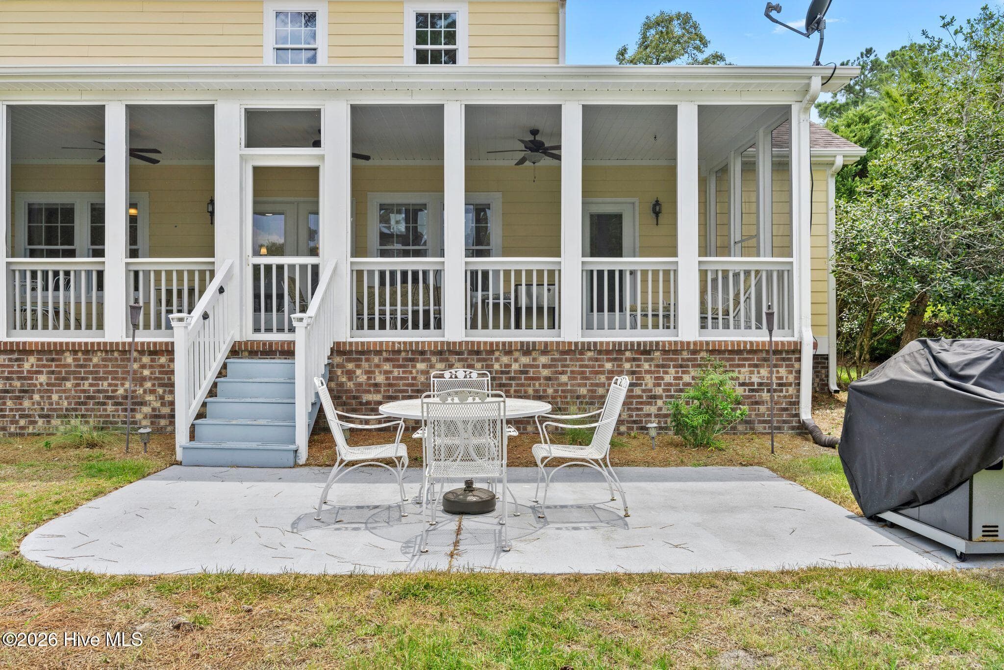 Large paved patio w/grill, already connected to the gas line (conveys). - 1620 Golfers Ridge Drive SE, Bolivia, NC 28422