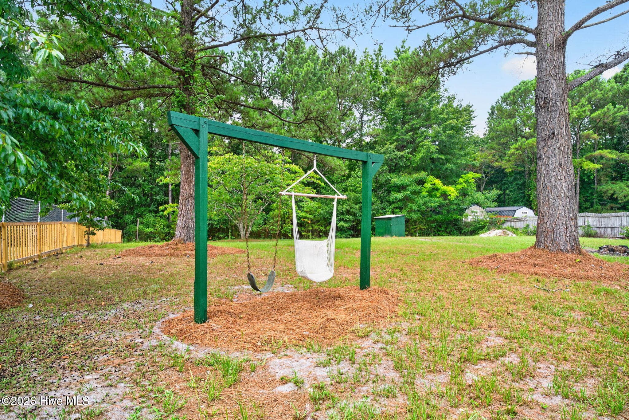 Enjoy the privacy and tranquility of this expansive backyard, complete with mature landscaping and room to create your ideal outdoor retreat. - 1199 Zack Street SE, Bolivia, NC 28422