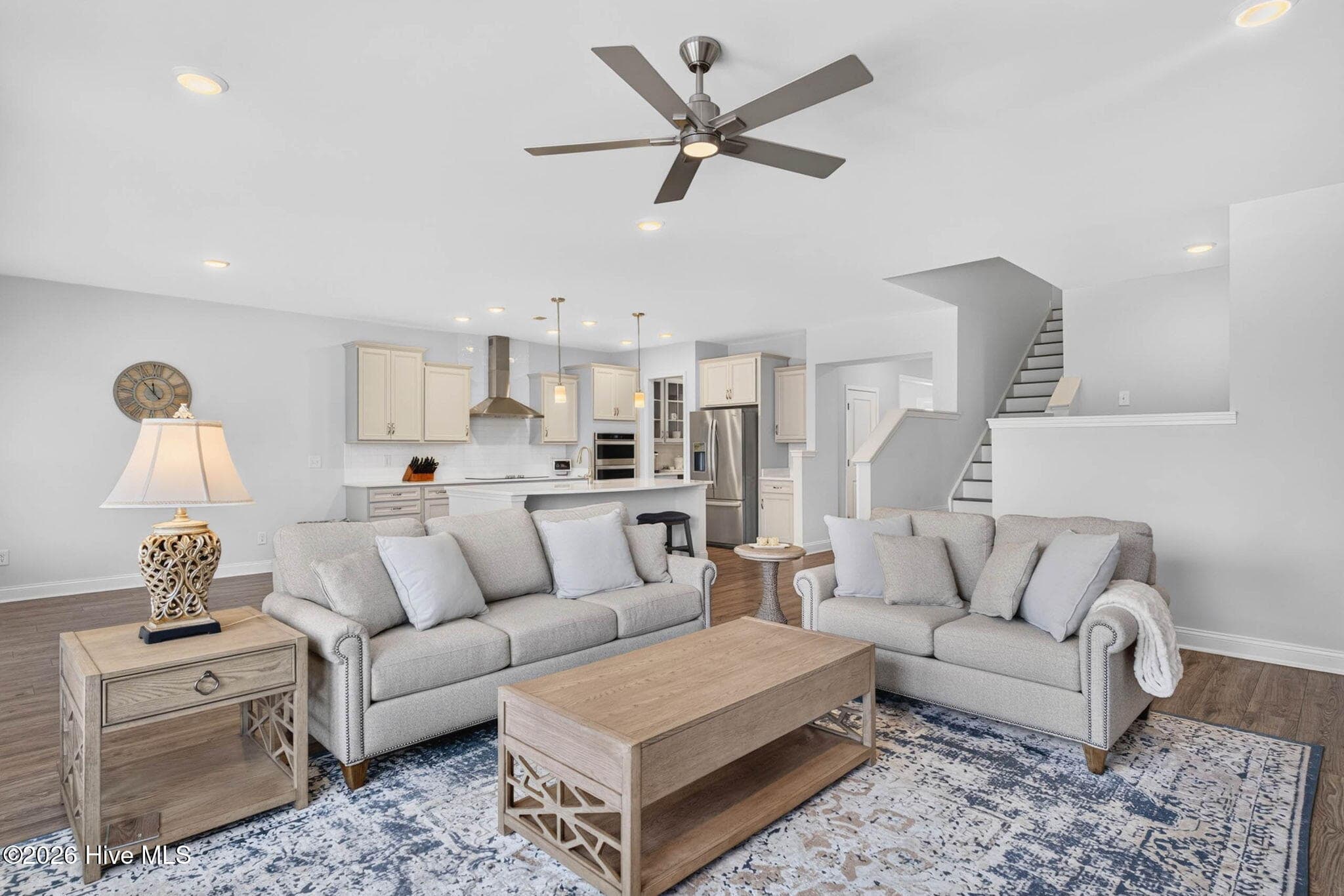 An open-concept living area creates an easy flow between the kitchen, dining spaces, and gathering room. - 139 Eagle Claw Drive, Calabash, NC 28467