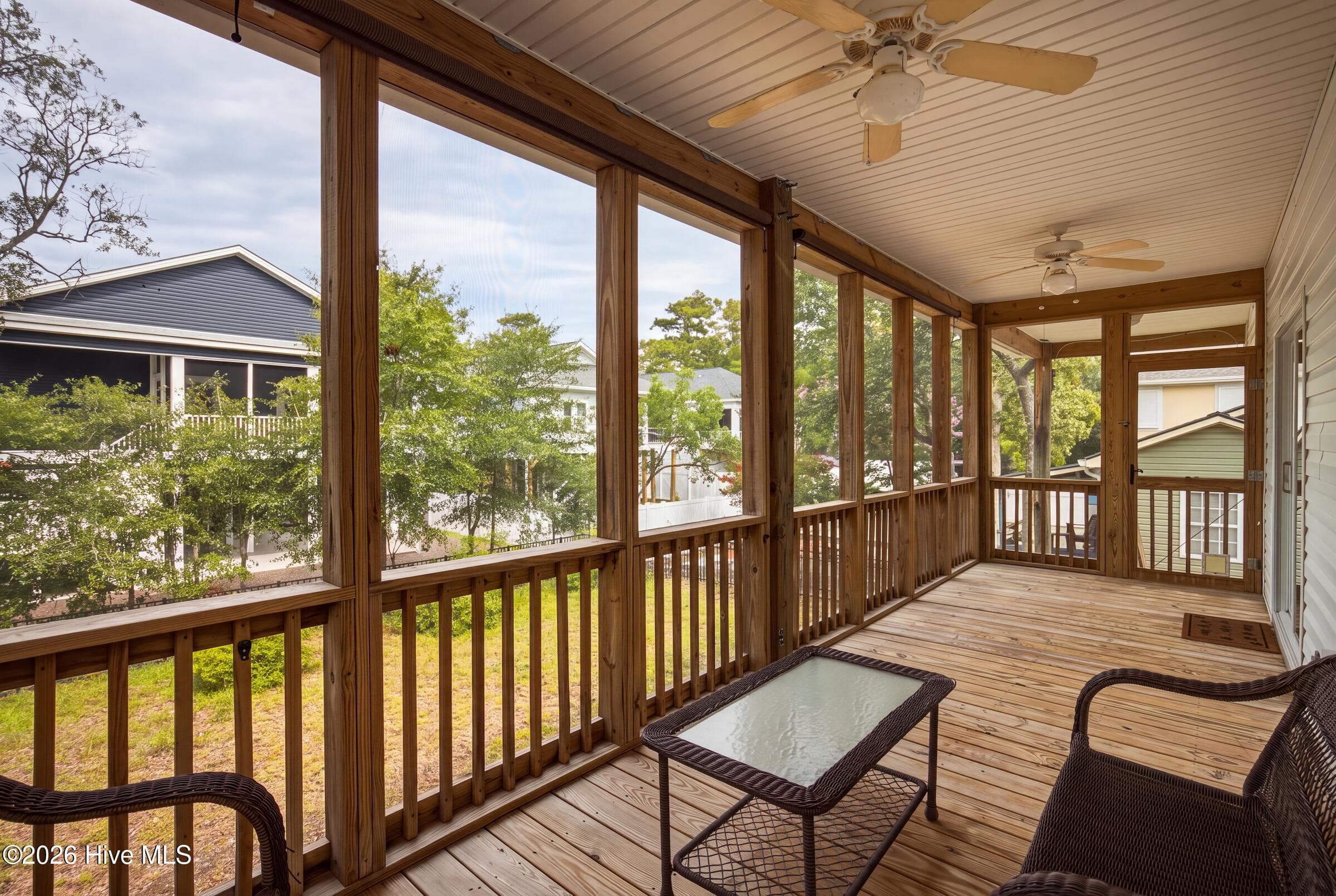 SCREENED BACK PORCH overlooking Back Yard - 225 NE 39th Street, Oak Island, NC 28465