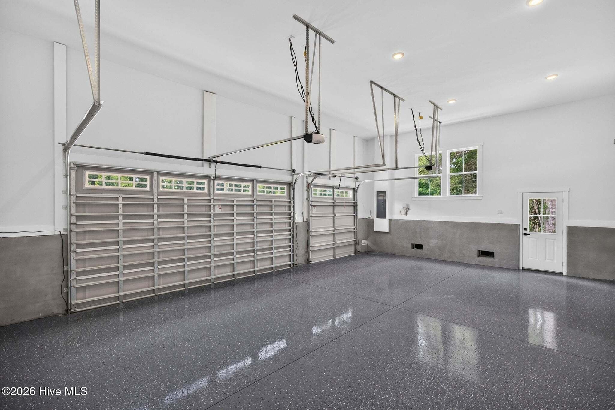 Oversized 3 car garage with epoxy floor and oversized doors. - 550 Glenburnie Street NW, Calabash, NC 28467