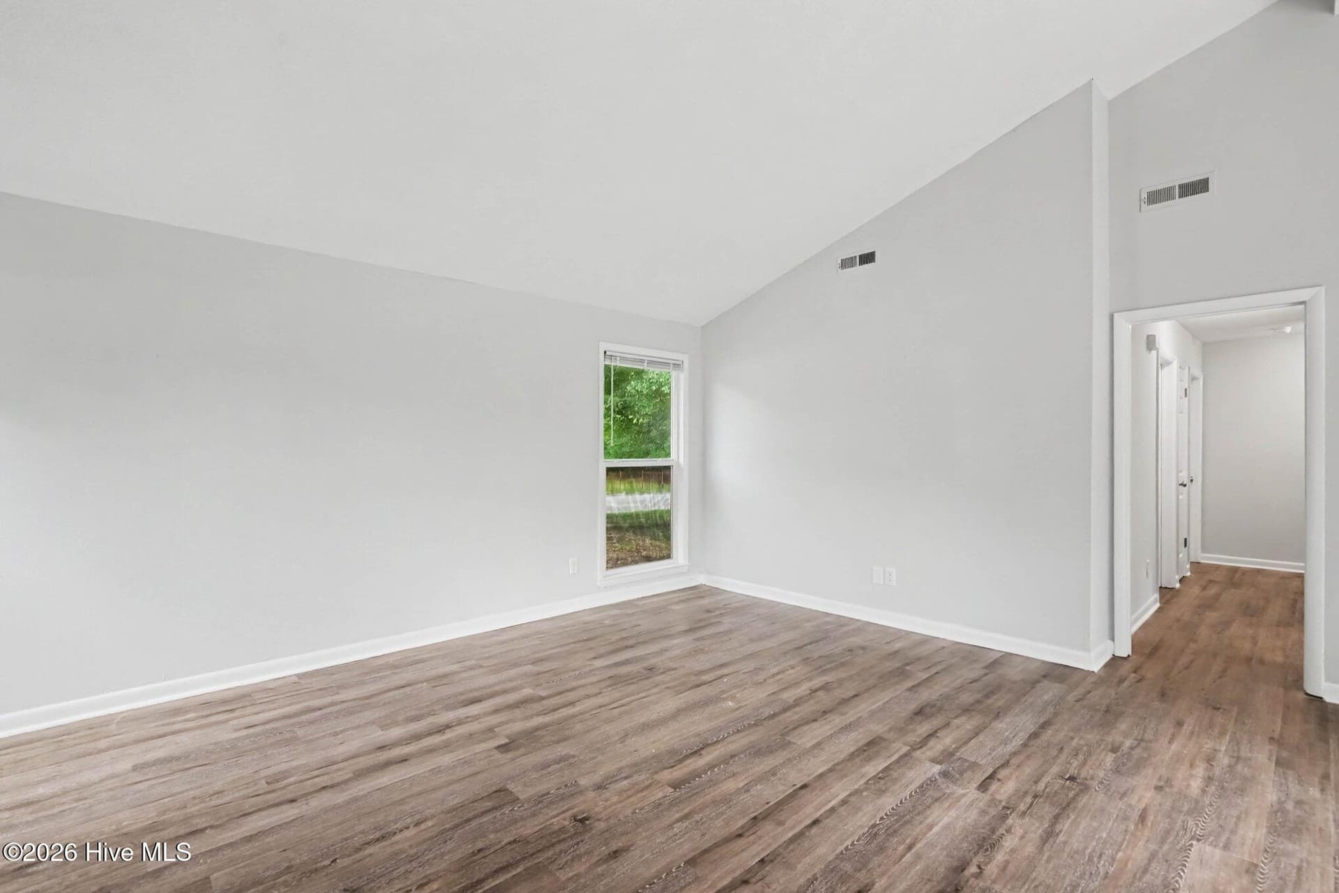 Views from the living room into the hall and bedroom area of the home. - 108 Deerfield Drive, Spring Lake, NC 28390