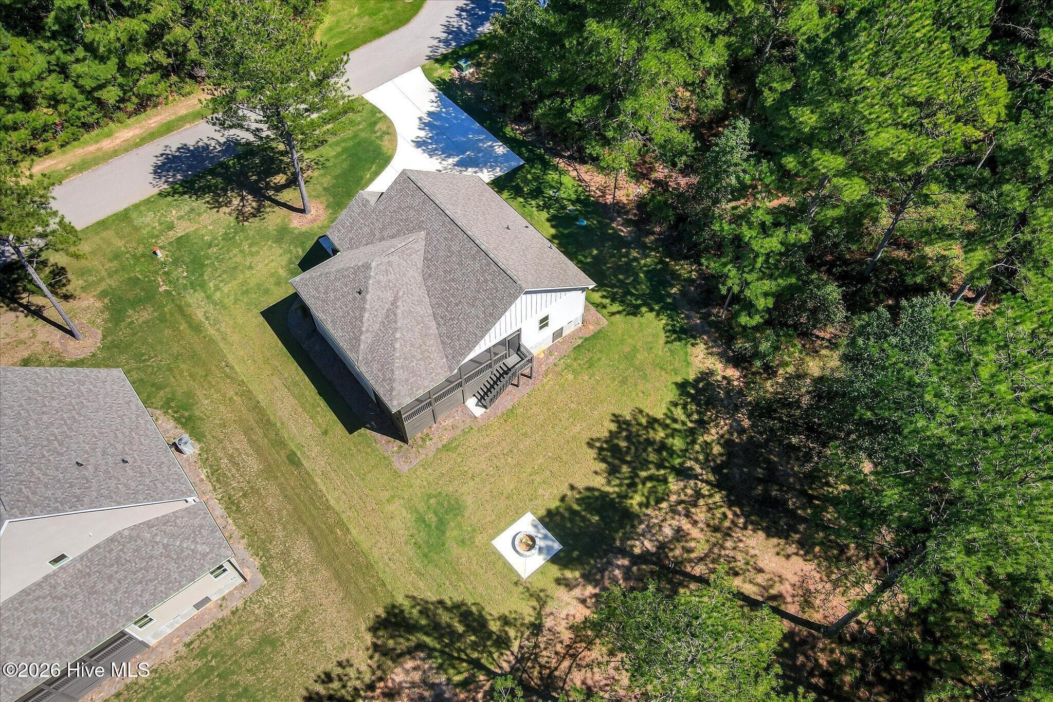 Large backyard with fire pit and trail to the lake. - 1198 Sunset Cove, Tignall, GA 30668