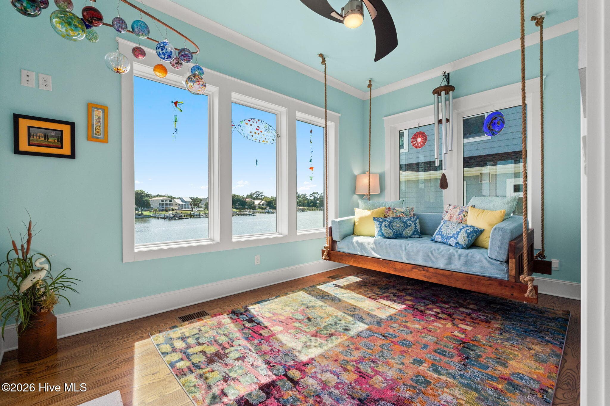 This is the happy room bursting with color and natural light. - 2775 Long Bay Drive SE, Southport, NC 28461