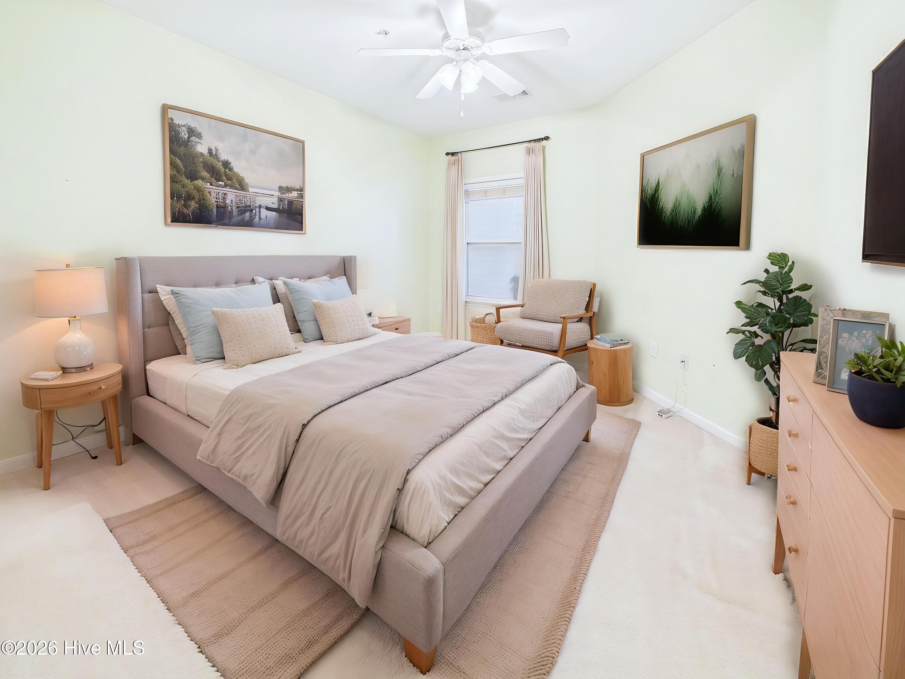 Virtually staged - primary bedroom - 3909 Botsford Court Unit 103, Wilmington, NC 28412