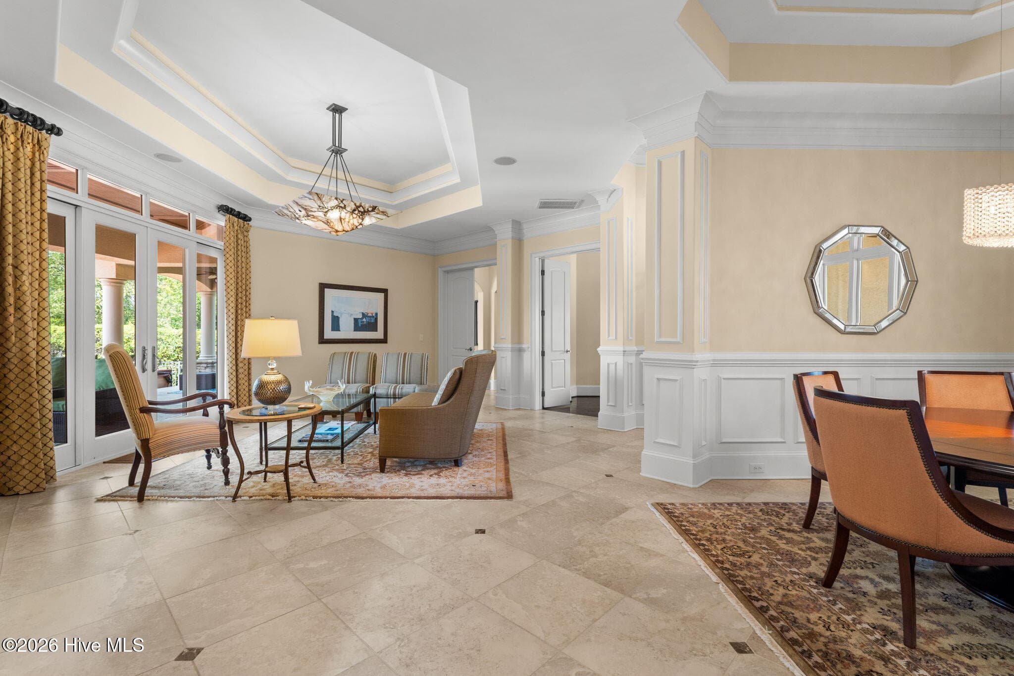 Living room showing proximity to formal dining room - 3858 Ridge Crest Drive, Southport, NC 28461
