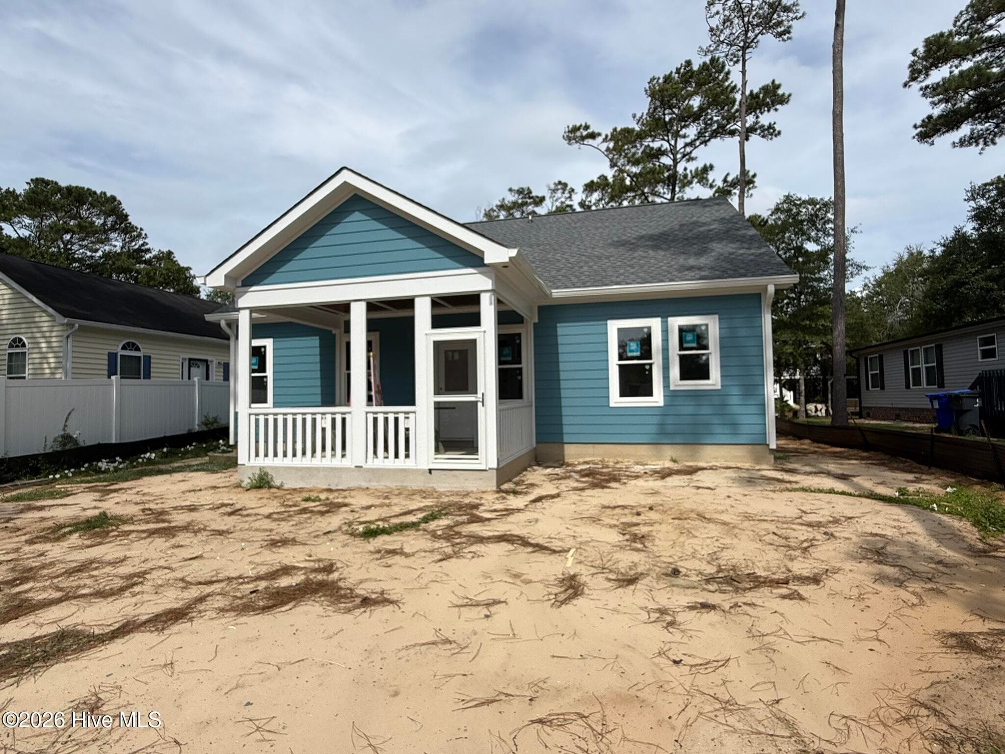 With screened in porch - 254 NE 66th Street, Oak Island, NC 28465