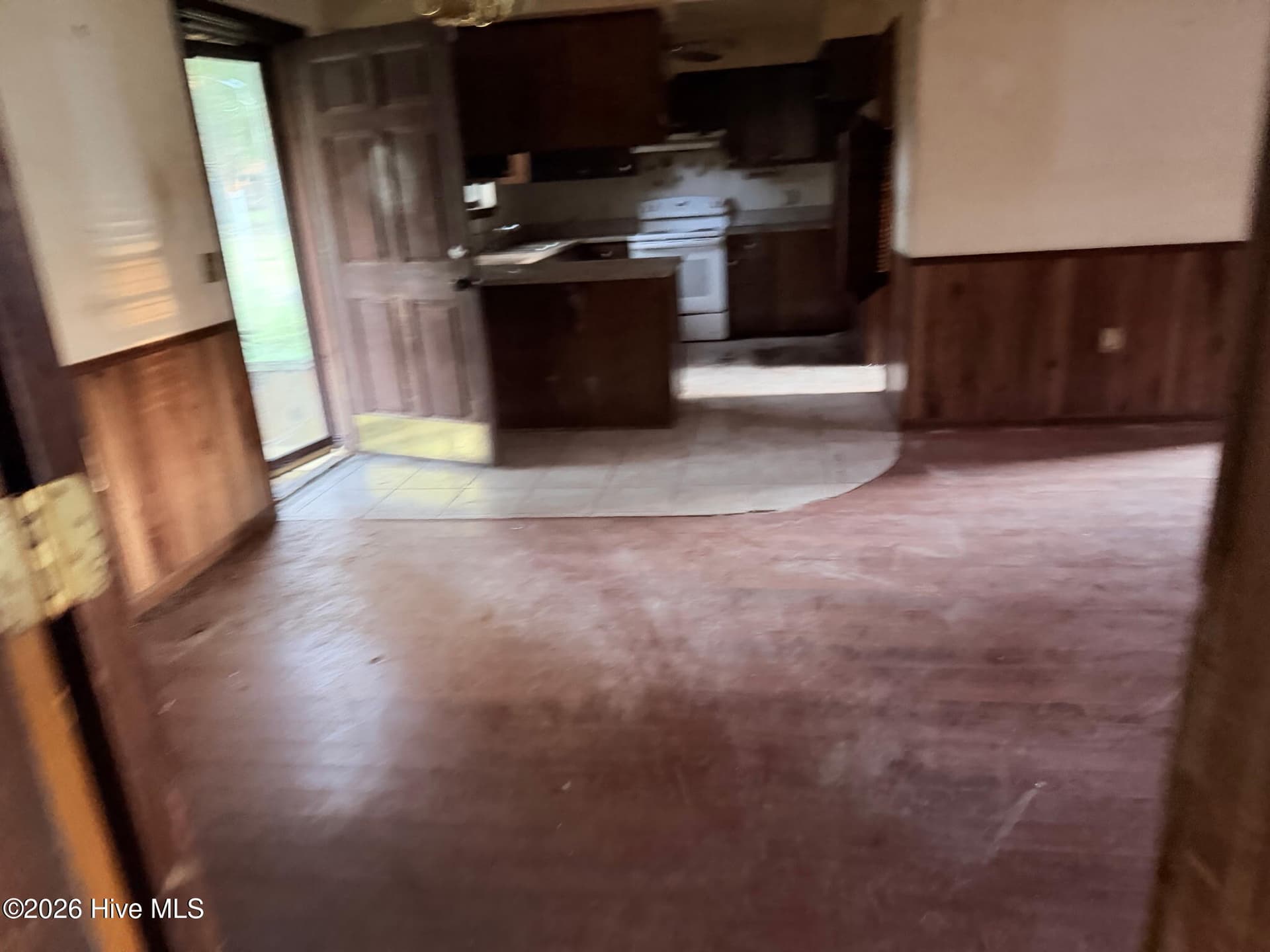 Living room looking at kitchen - 156 N Jefferson Street Ext, Lyons, GA 30436
