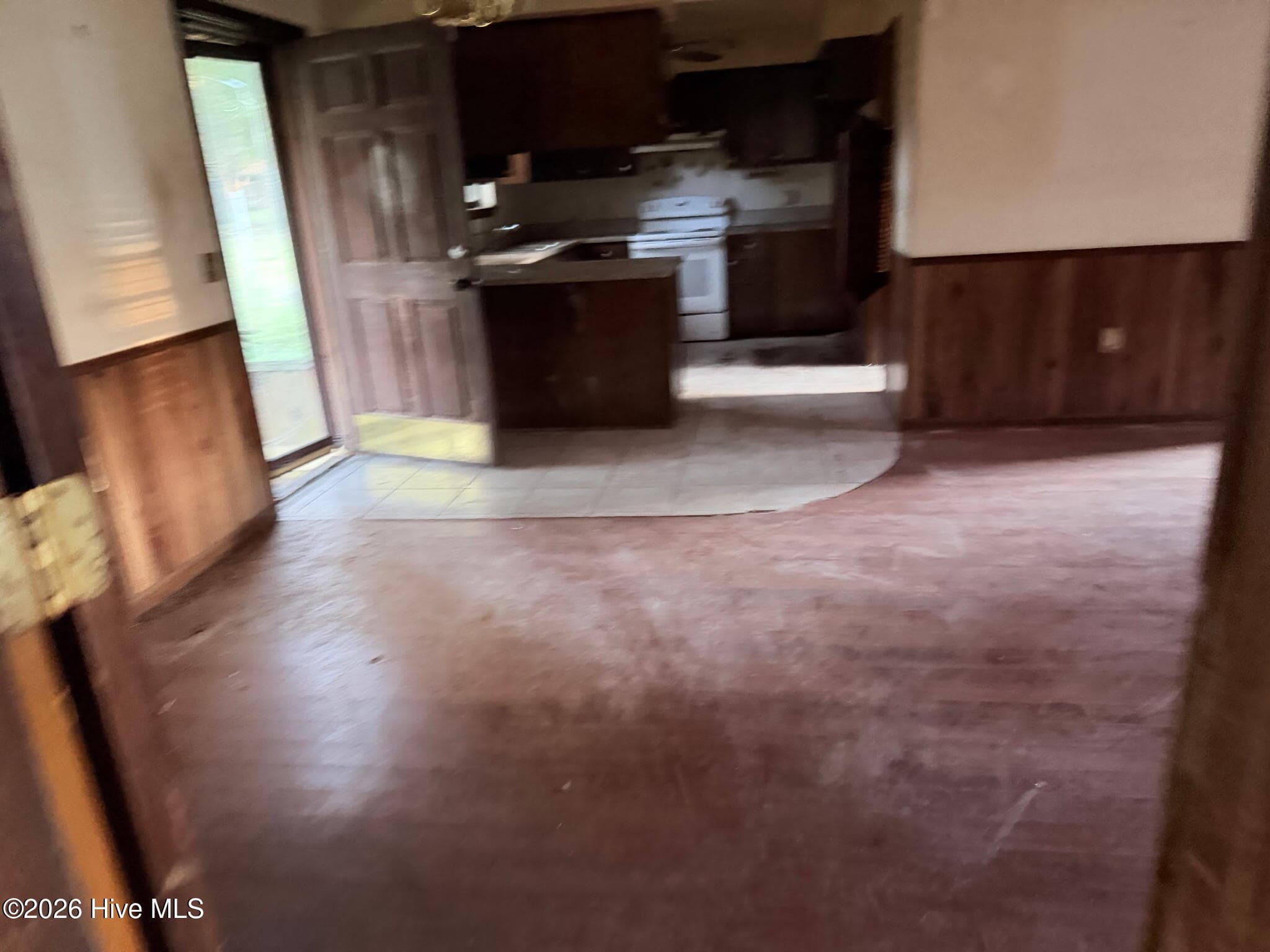 Living room looking at kitchen - 156 N Jefferson Street Ext, Lyons, GA 30436