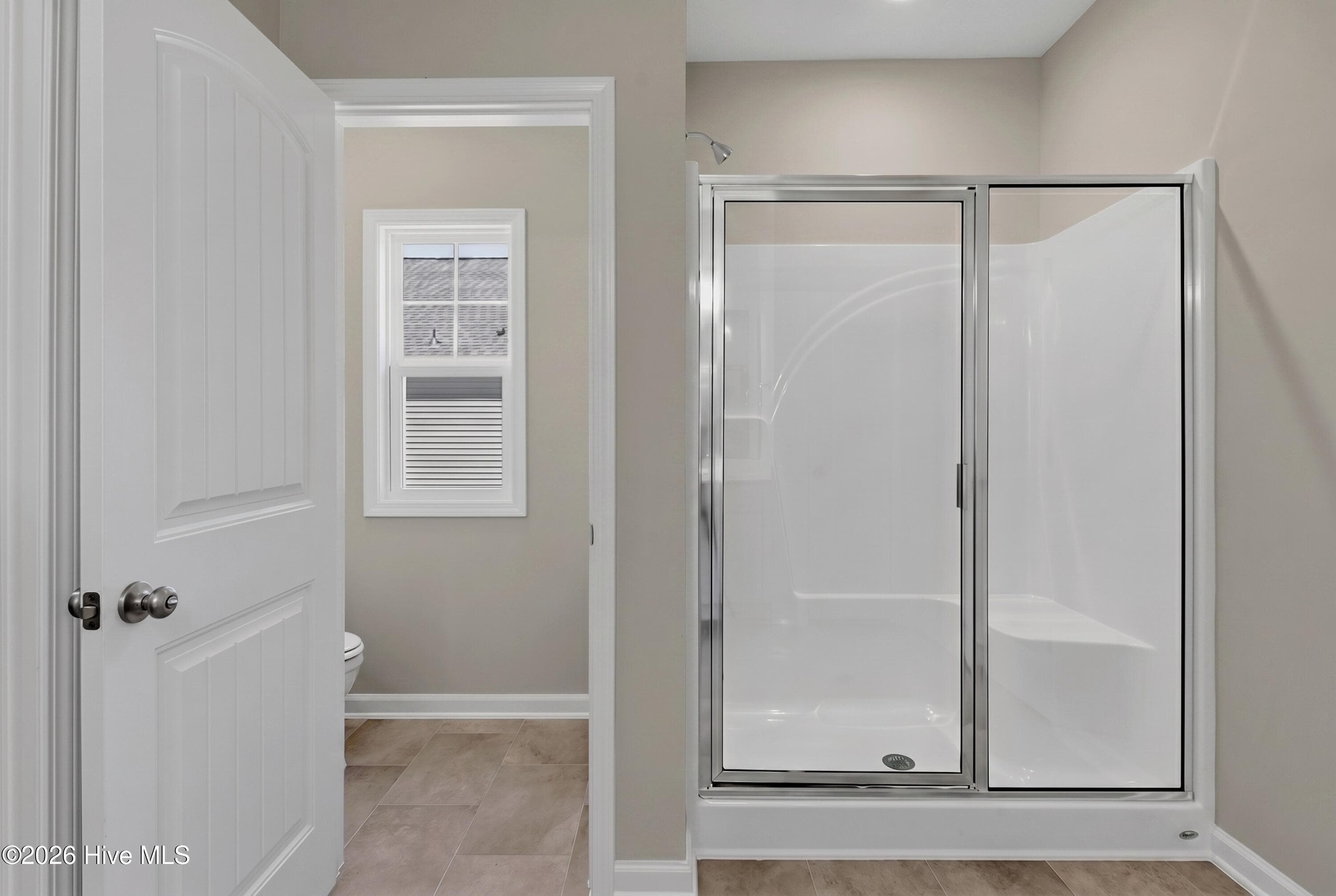 Example photo of similar home. Actual home is under construction and will feature a Tile Shower in the Primary Bathroom - 4149 Workman Loop 67, Leland, NC 28451