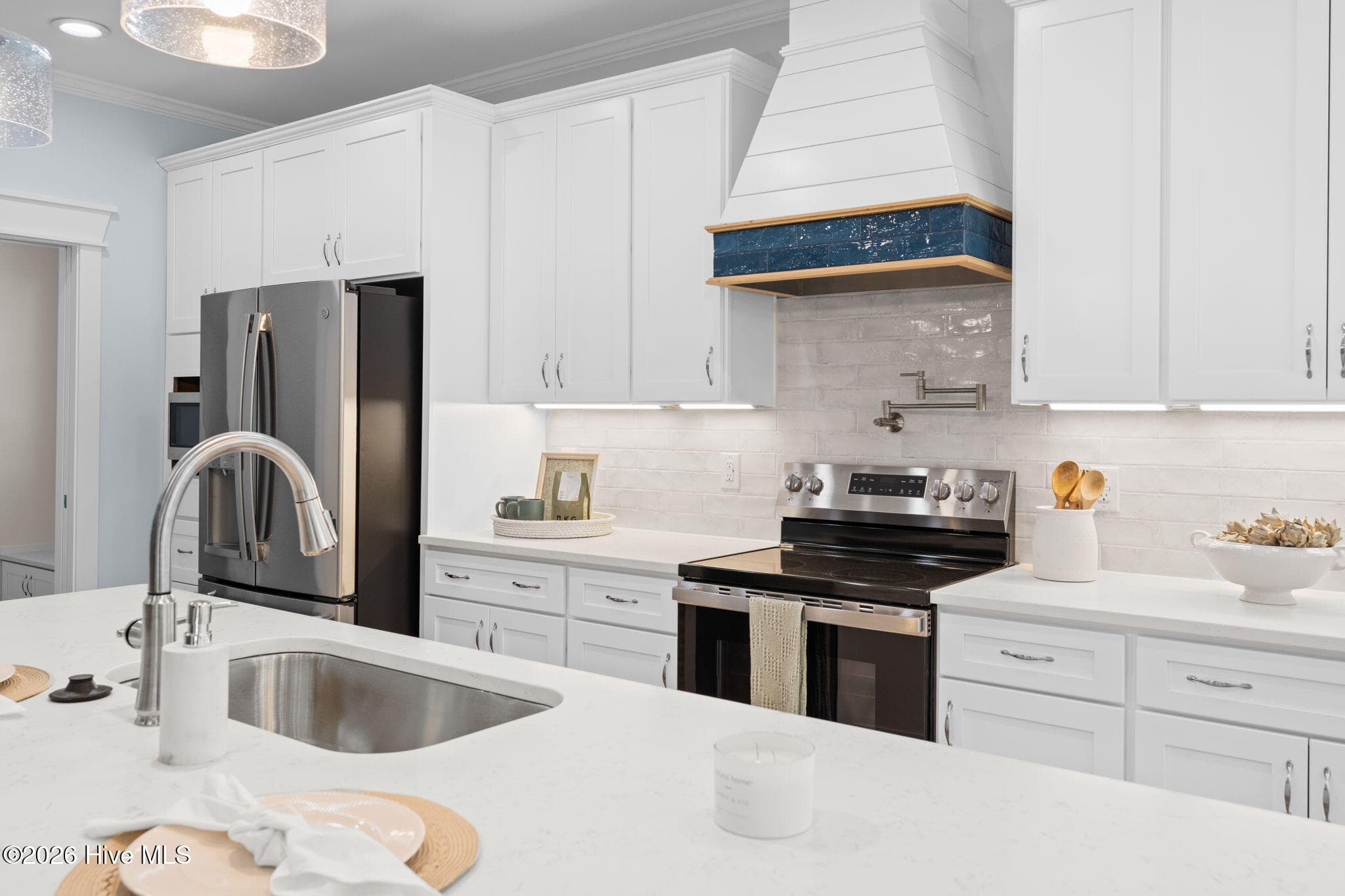 Photos of a staged model of the exact same plan - 312 NE 58th Street, Oak Island, NC 28465
