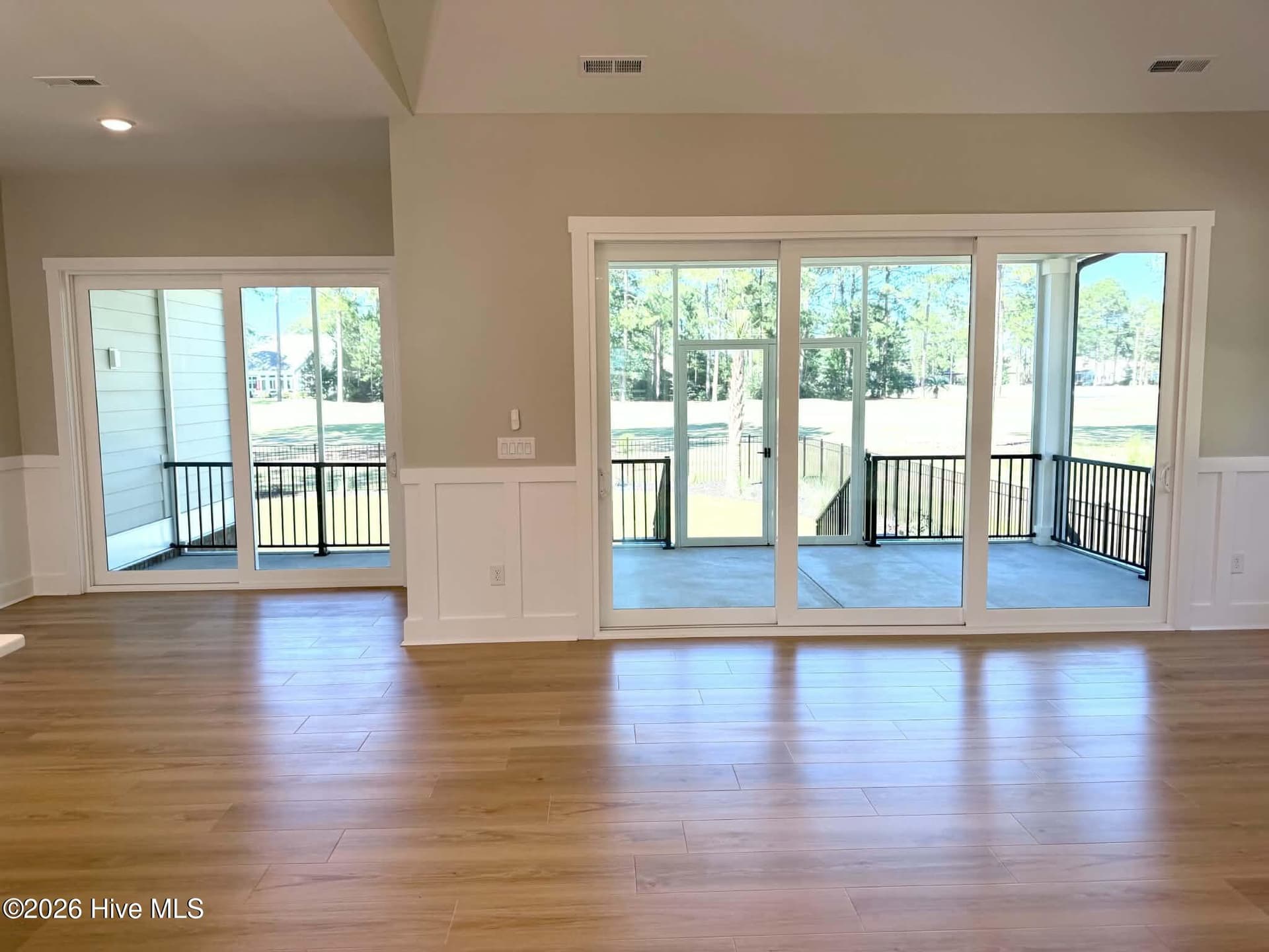 Great room area Great room area, upgraded Pergo flooring and lighting. Looking out onto upgraded screen porch with upgraded fenced back yard. - 550 Glenburnie Street NW, Calabash, NC 28467