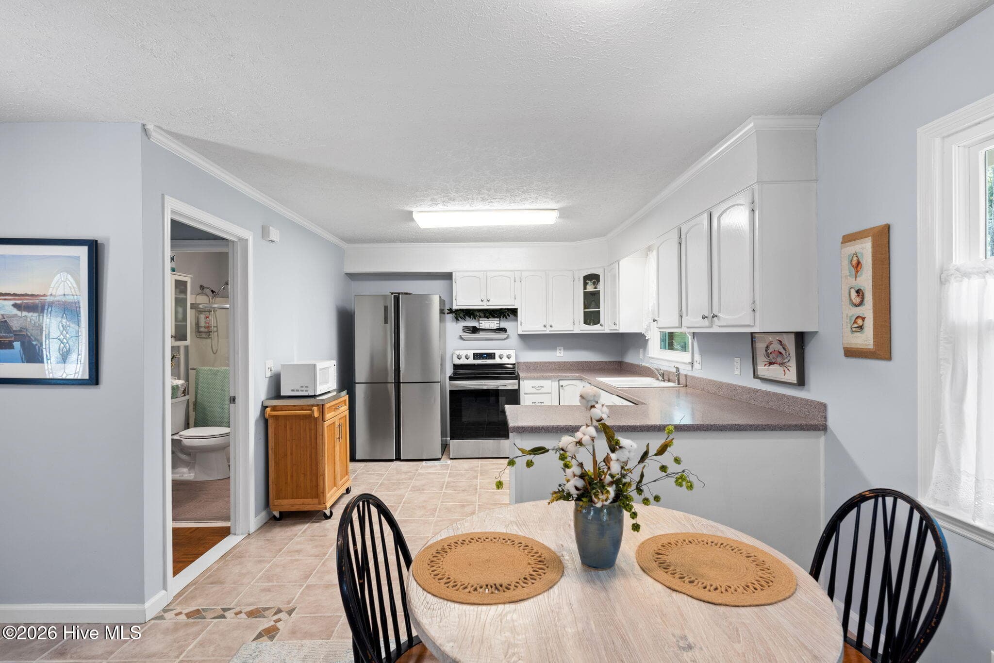 open dining and kitchen - 1 Golfview Court, Carolina Shores, NC 28467