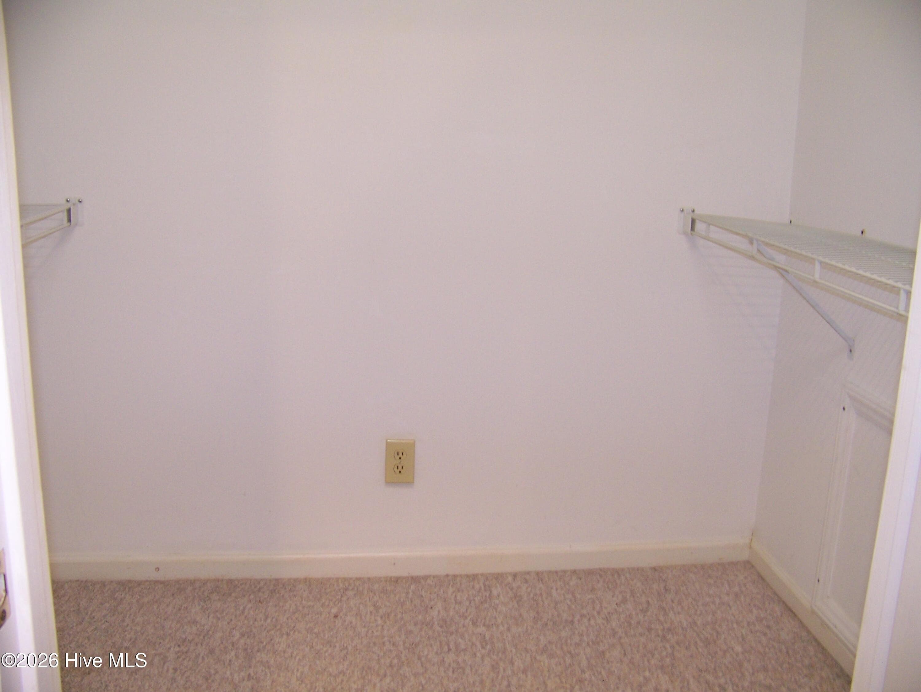The master walk in closet is off of the bathroom. - 703 Cedarwood Village, Morehead City, NC 28557