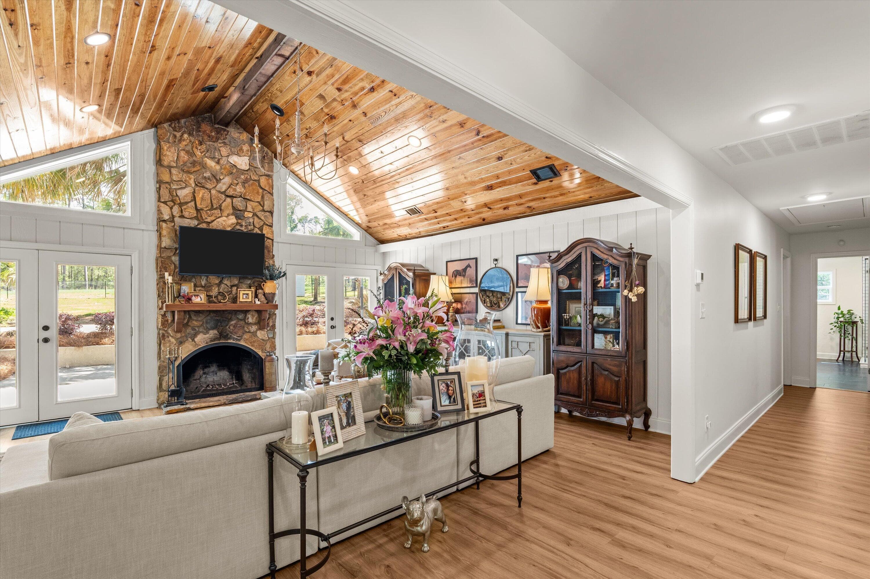 Step inside and be greeted with beautiful wooden ceilings and a stone fireplace - 140 Lewiston Road, Grovetown, GA 30813