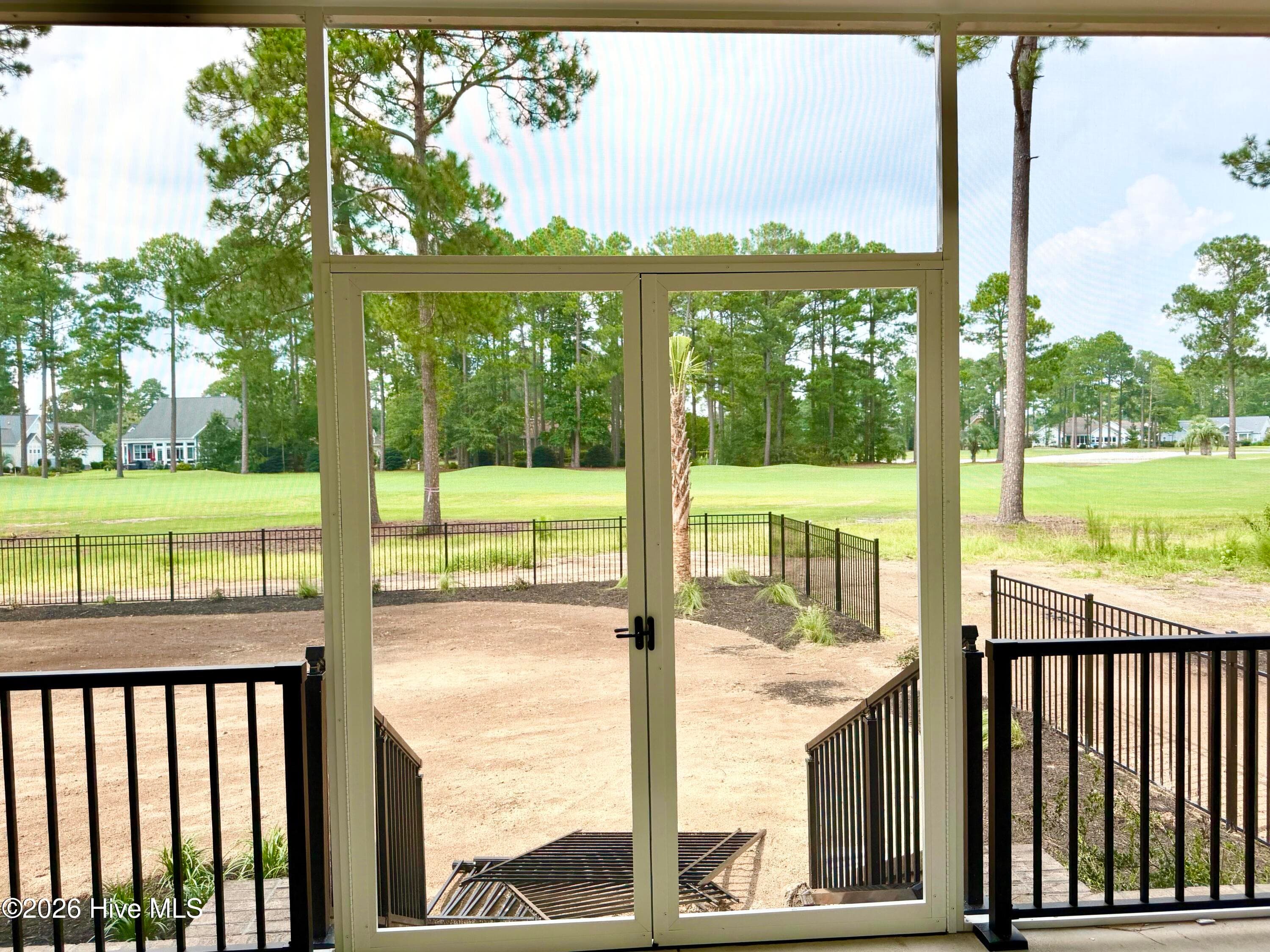 Screen porch view of golf course, under construction. - 550 Glenburnie Street NW, Calabash, NC 28467