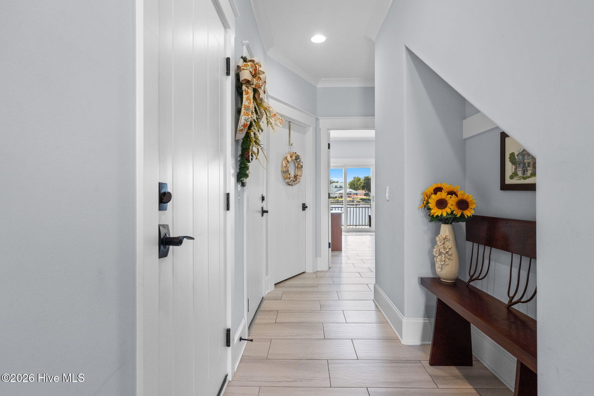 Entry to one garage, elevator and huge storage room with a drop zone - 2775 Long Bay Drive SE, Southport, NC 28461