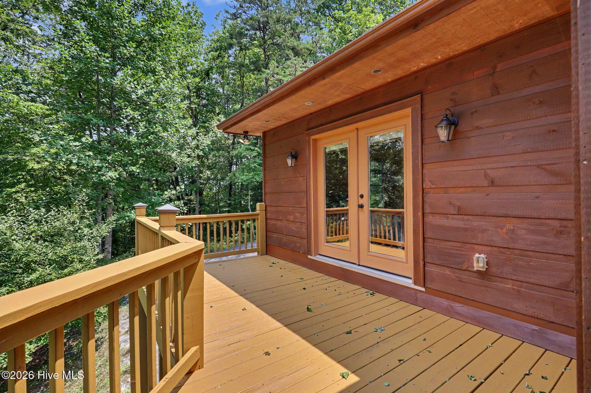 Expansive deck extends along the side of the home. - 210 Majestic Drive, Hayesville, NC 28904