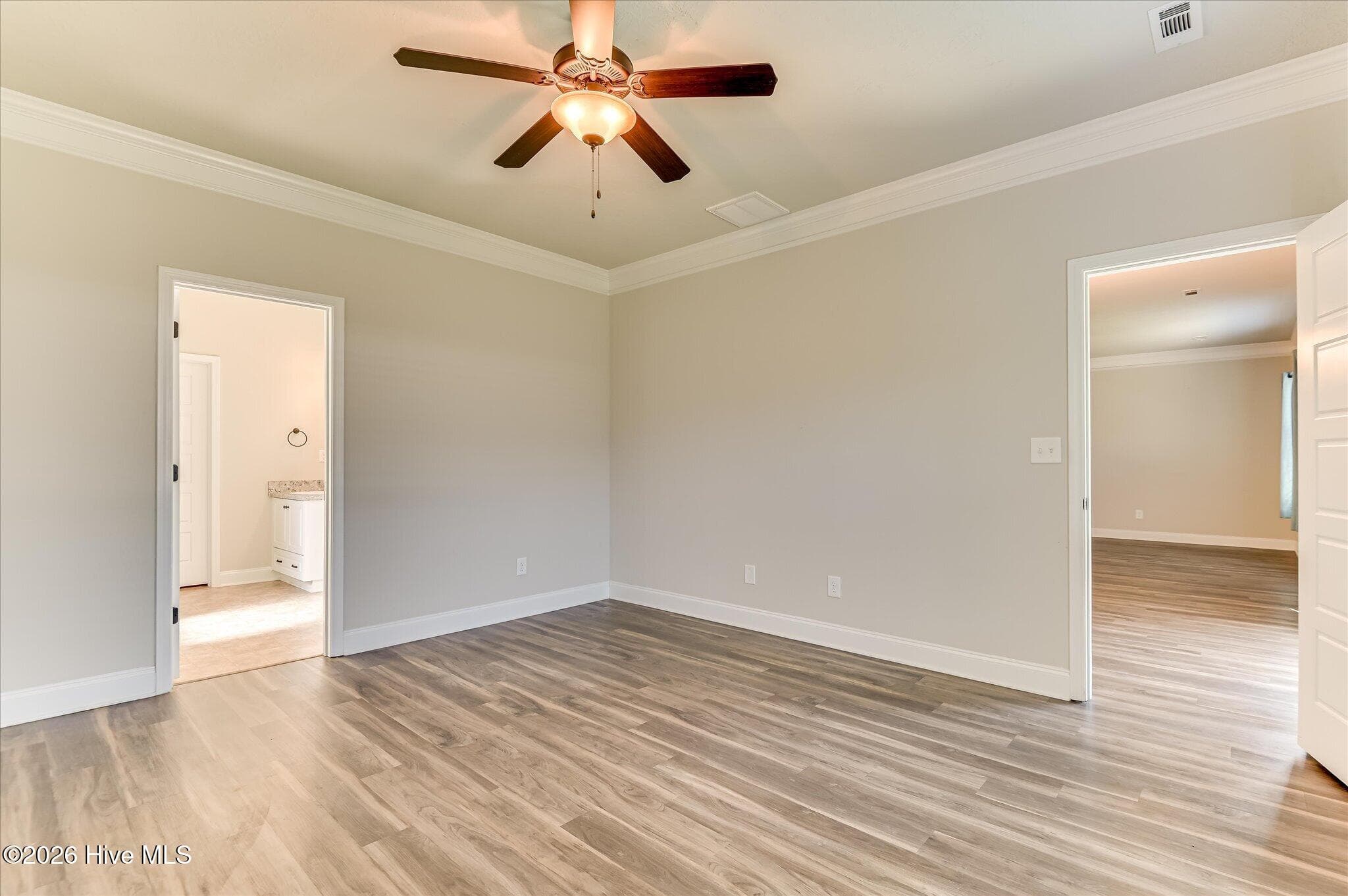 Primary bedroom with view of bathroom and great room - 160 Swinton Pond Road, Grovetown, GA 30813