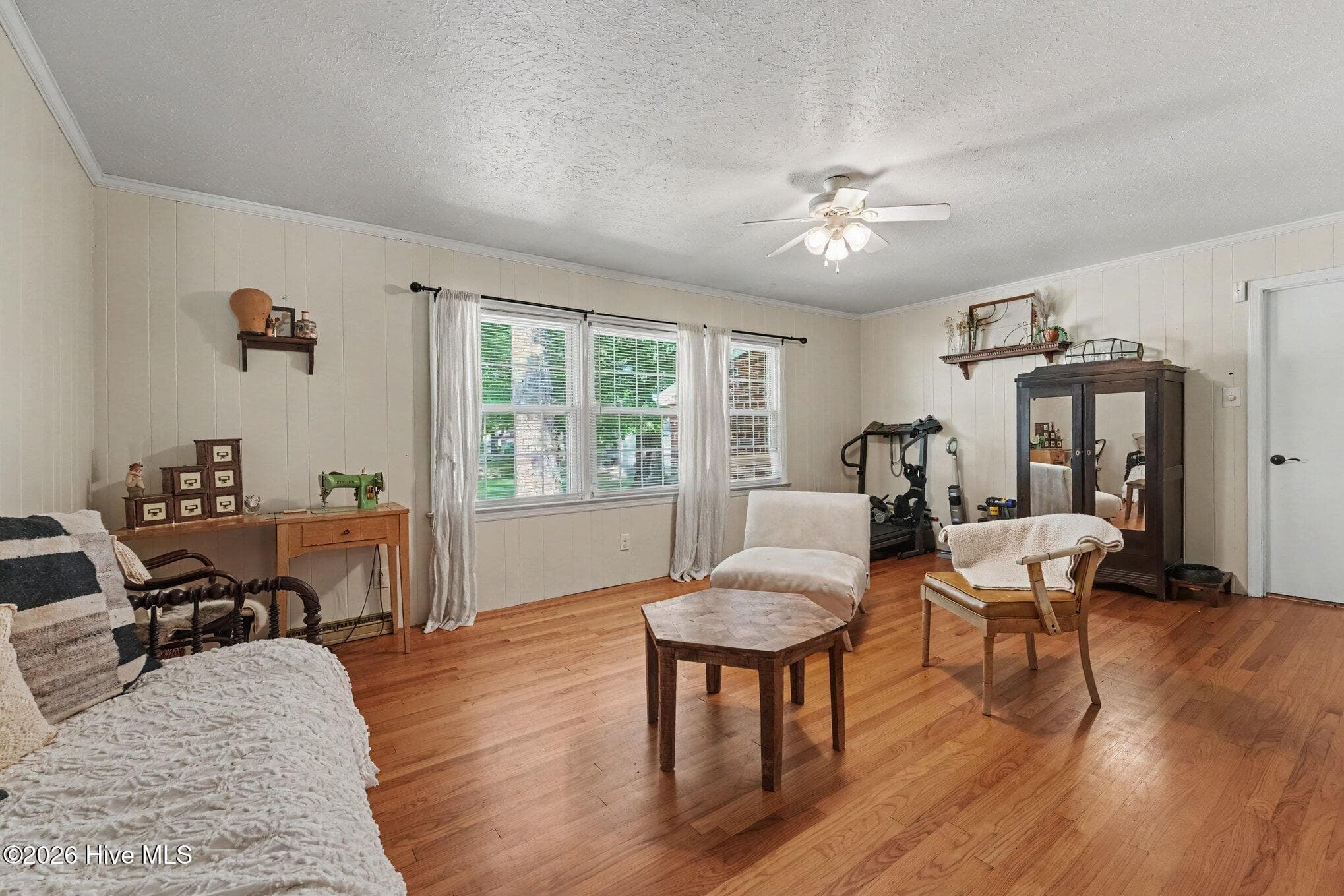 Family room with hardwood flooring and ceiling fan - 1017 S Claiborne Street, Goldsboro, NC 27530