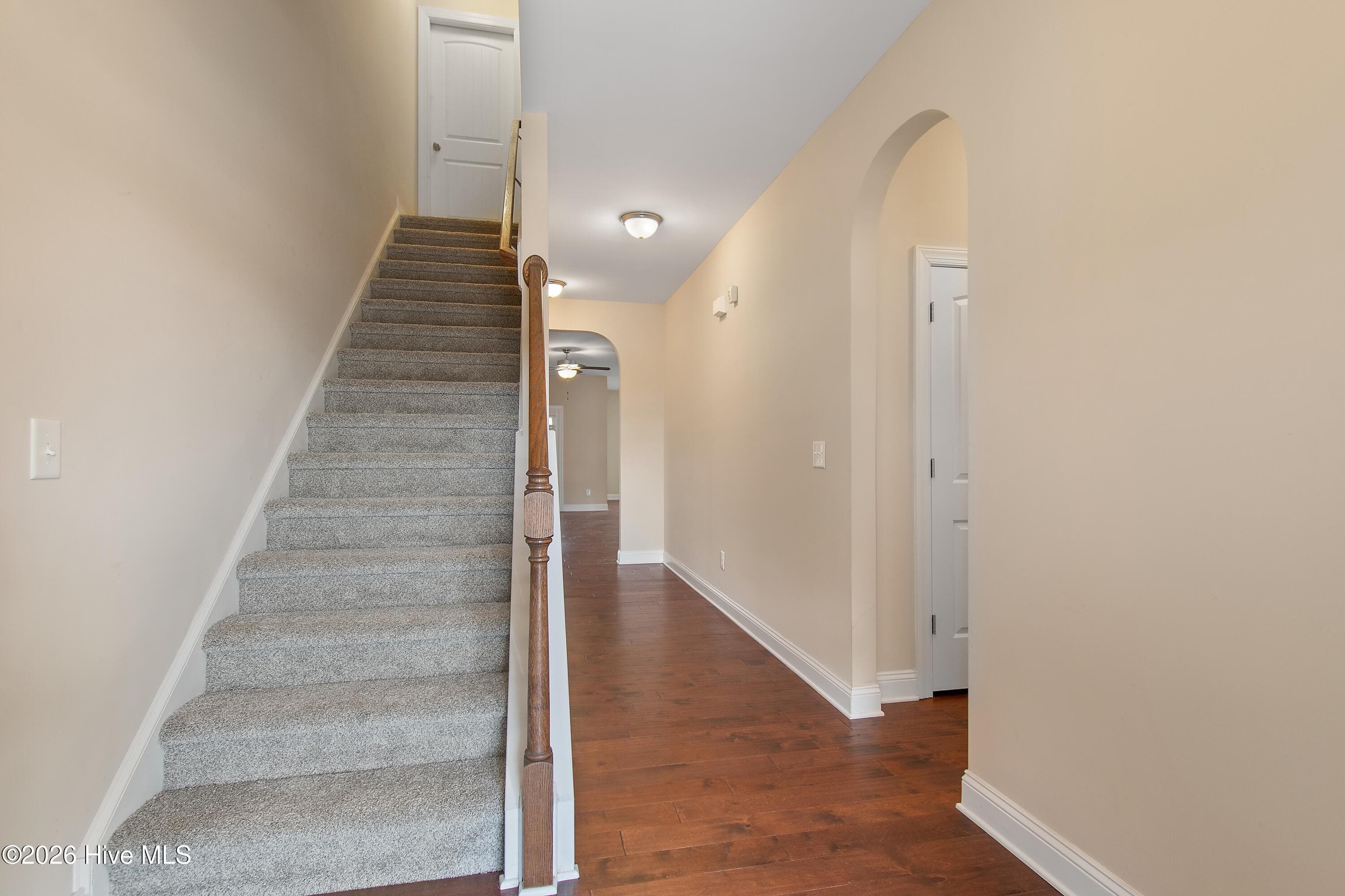 Entry way with staircase to second story to your left and 2 bedrooms through the right hallway. - 1674 Back Bay Drive SW, Shallotte, NC 28470