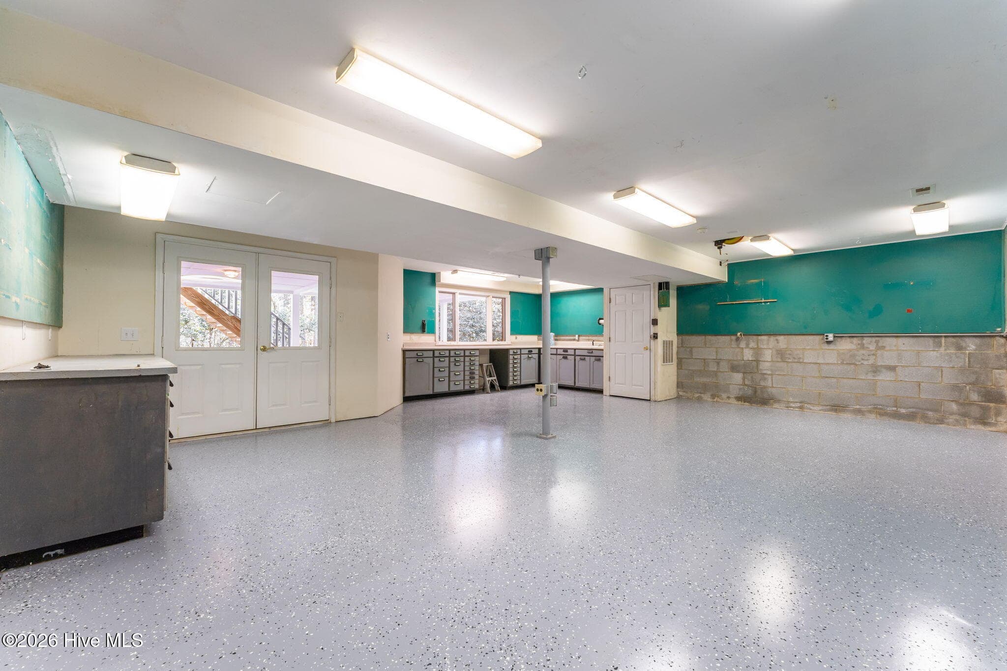 A dream workshop, spacious and loaded with all types of conveniences. New flooring here too. Easy access to outside and plenty of drawers for the tools. - 22 Lochmere Drive, Pinehurst, NC 28374