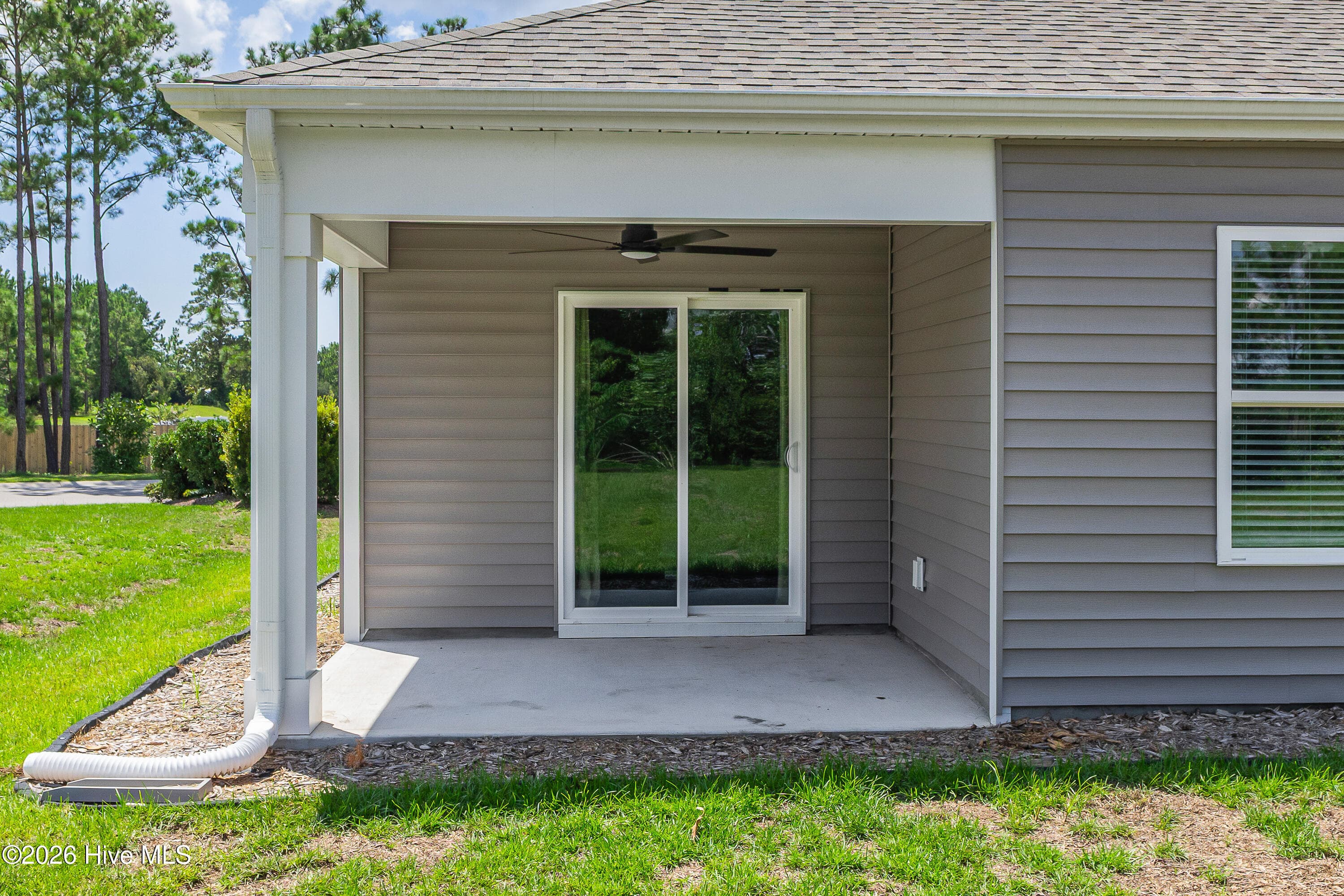covered patio with sliding doors - 1774 Culdees Lane SE, Bolivia, NC 28422